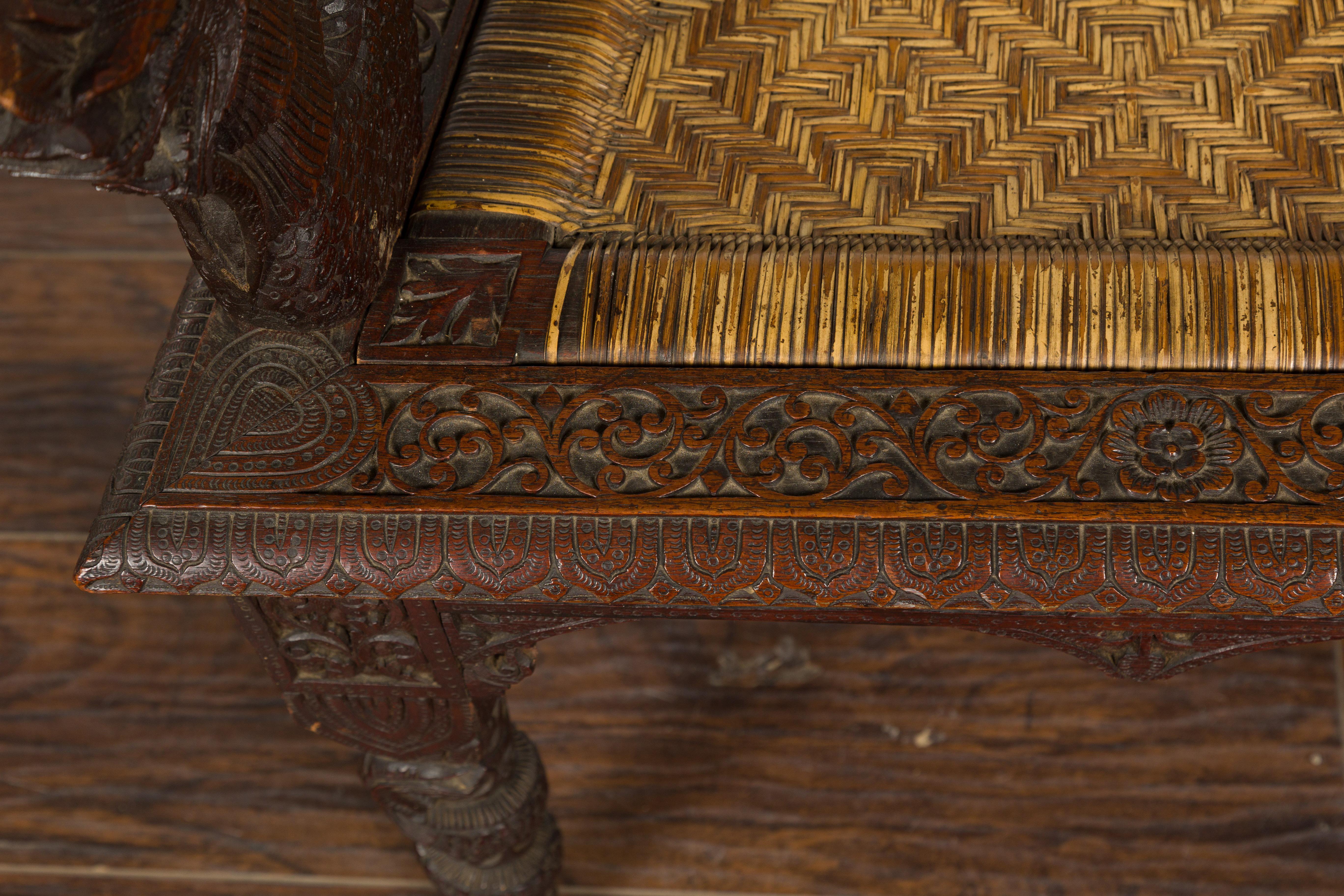 Anglo-Indian 1900 Armchair with Carved Back, Mythical Creatures and Woven Rattan For Sale 4