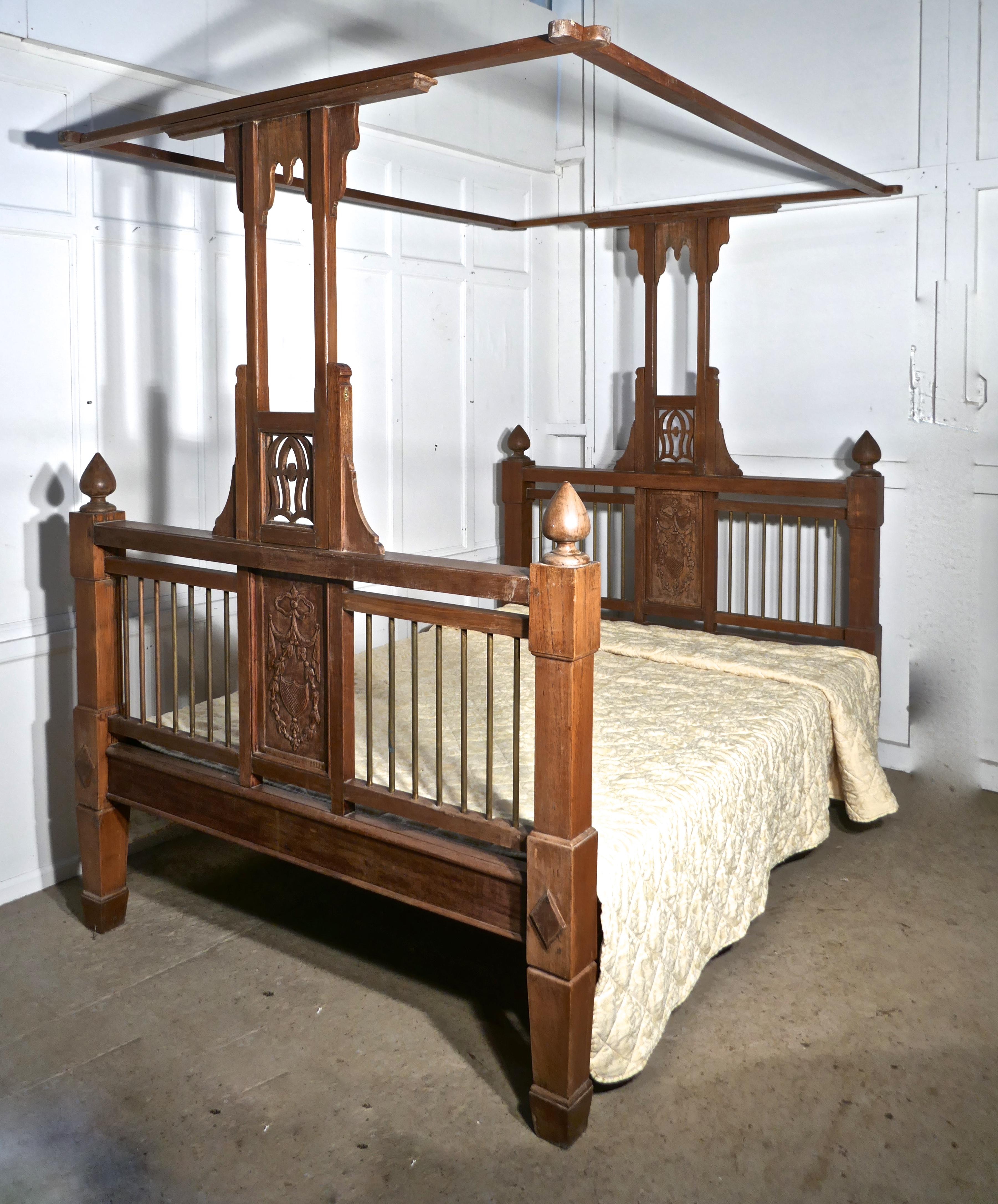 Anglo Indian Antique 4 Poster 5ft Double Bed

This is a very unusual bed it has slightly square lines with a pierced and carved central post leading up from the centre supporting the wide over bed canopy
The bed head and foot have chunky brass rails