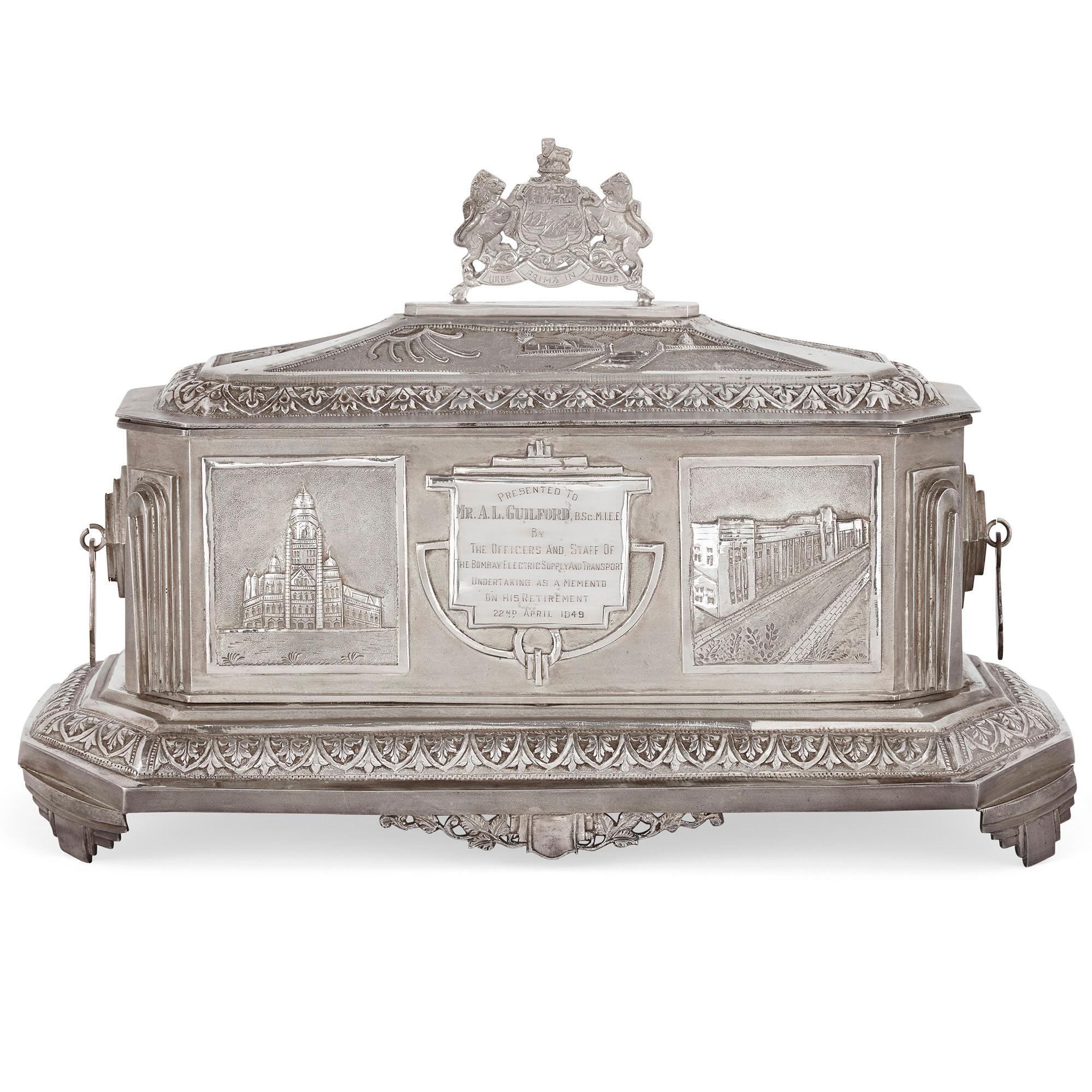 This Anglo-Indian silver casket is inscribed on a central panel to the front with the following: 'Presented to / Mr. A. L. Guildford, B.Sc. M.I.E.E. / By / The Officers and Staff of / The Bombay Electrical Supply and Transport / Undertaking as a