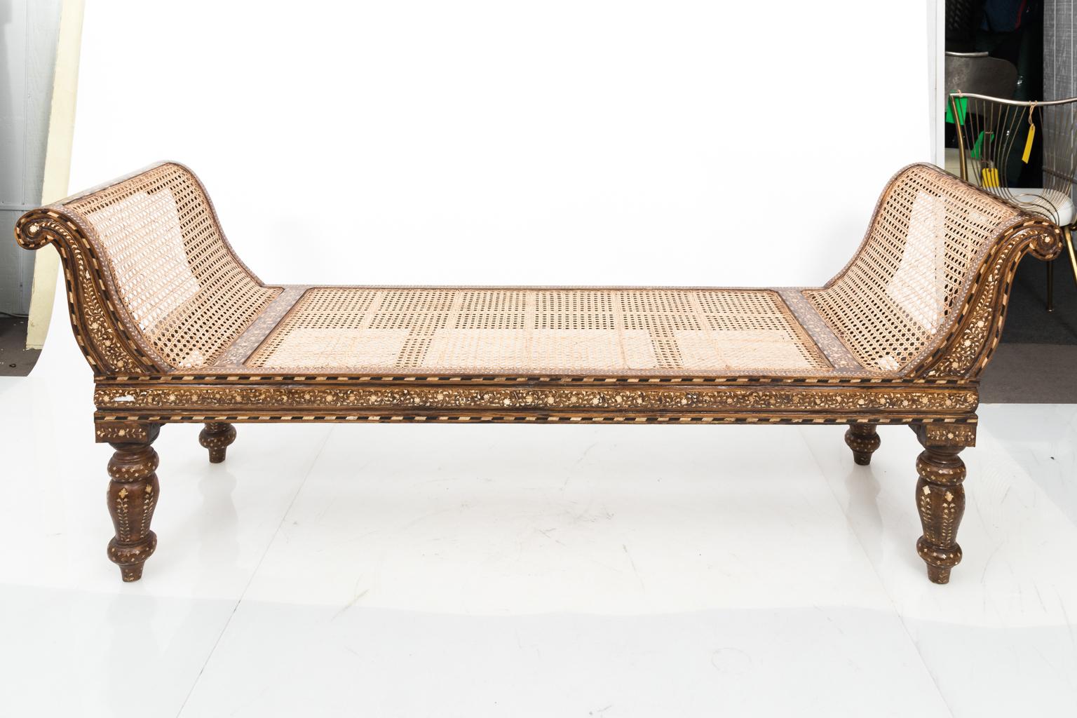 Anglo-Indian wood and bone inlaid bench with cane woven seat and bulb turned legs, circa 20th century. The inlay also features floral detail throughout.