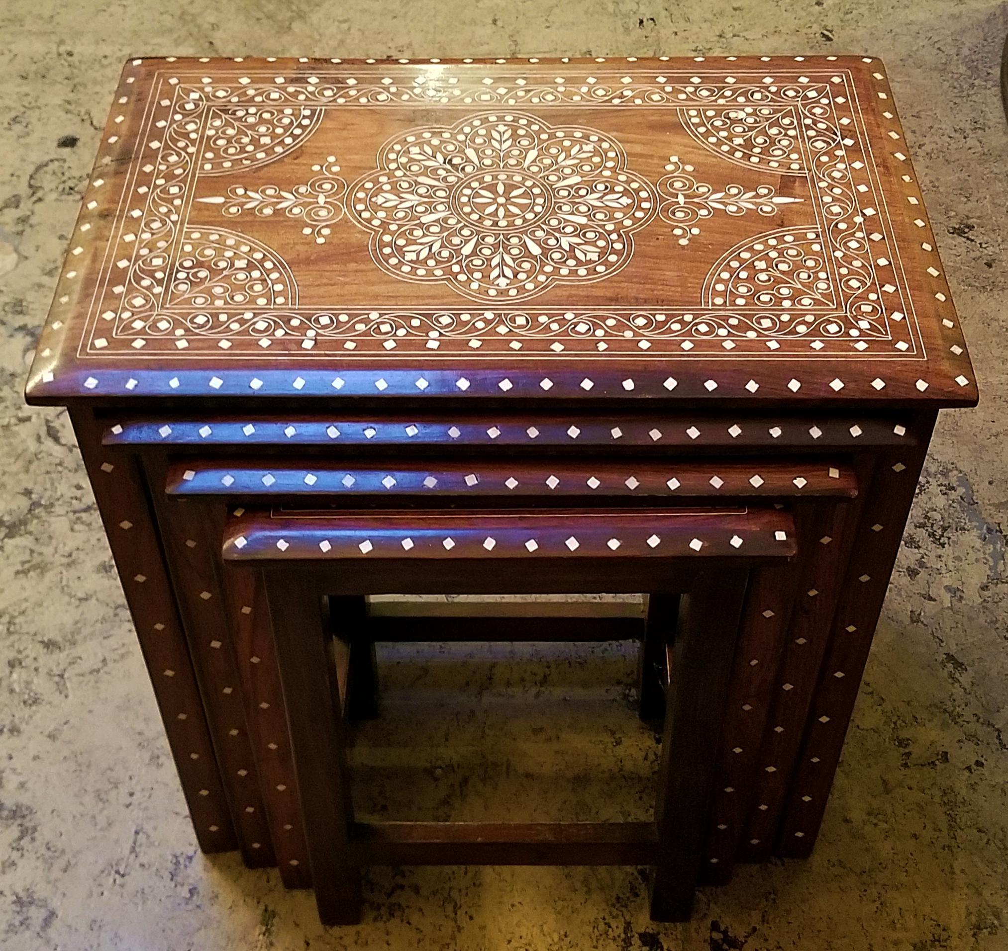 Presenting a gorgeous set of late 19th or early 20th century Anglo-Indian bone inlaid nest of tables.

From circa 1890-1900.

Made of teak and profusely inlaid with bone in floral and geometric patterns.

Four tables in all, each smaller than