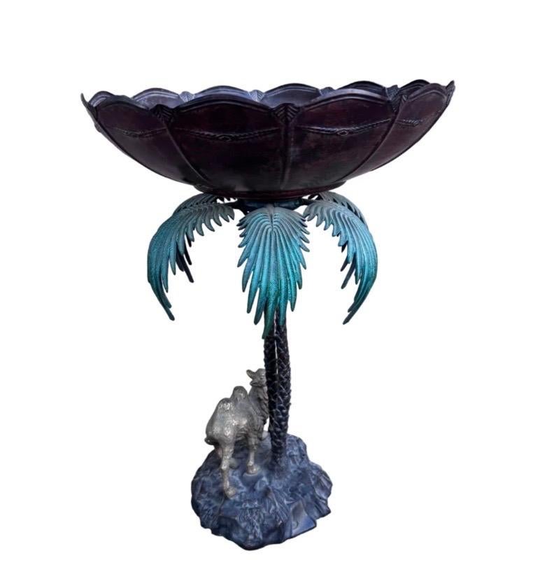 Anglo Indian Bronze Serving Bowl on a Palm Tree Stand with Camel

British colonial style cast bronze fruit or serving bowl on a palm tree stand over a camel on a faux terra firma base.

Circa Late 20th Century

Dimensions 

H 19”

D 13”


