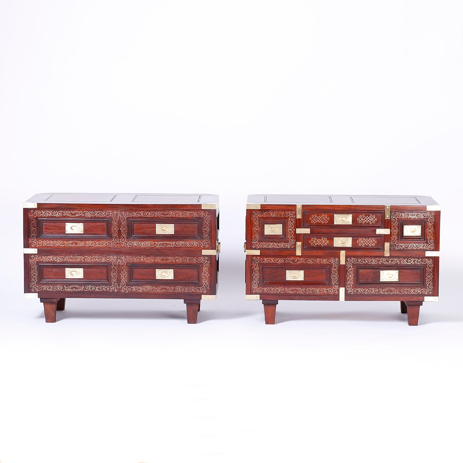 Anglo Indian pair of nightstands with the unusual duel option of stacking into a chest of drawers. Featuring rosewood construction, inlaid brass floral designs, panels sides, and tapered legs.

Measures: Nightstands H 19, W 30, D 15
Chest H 34, W