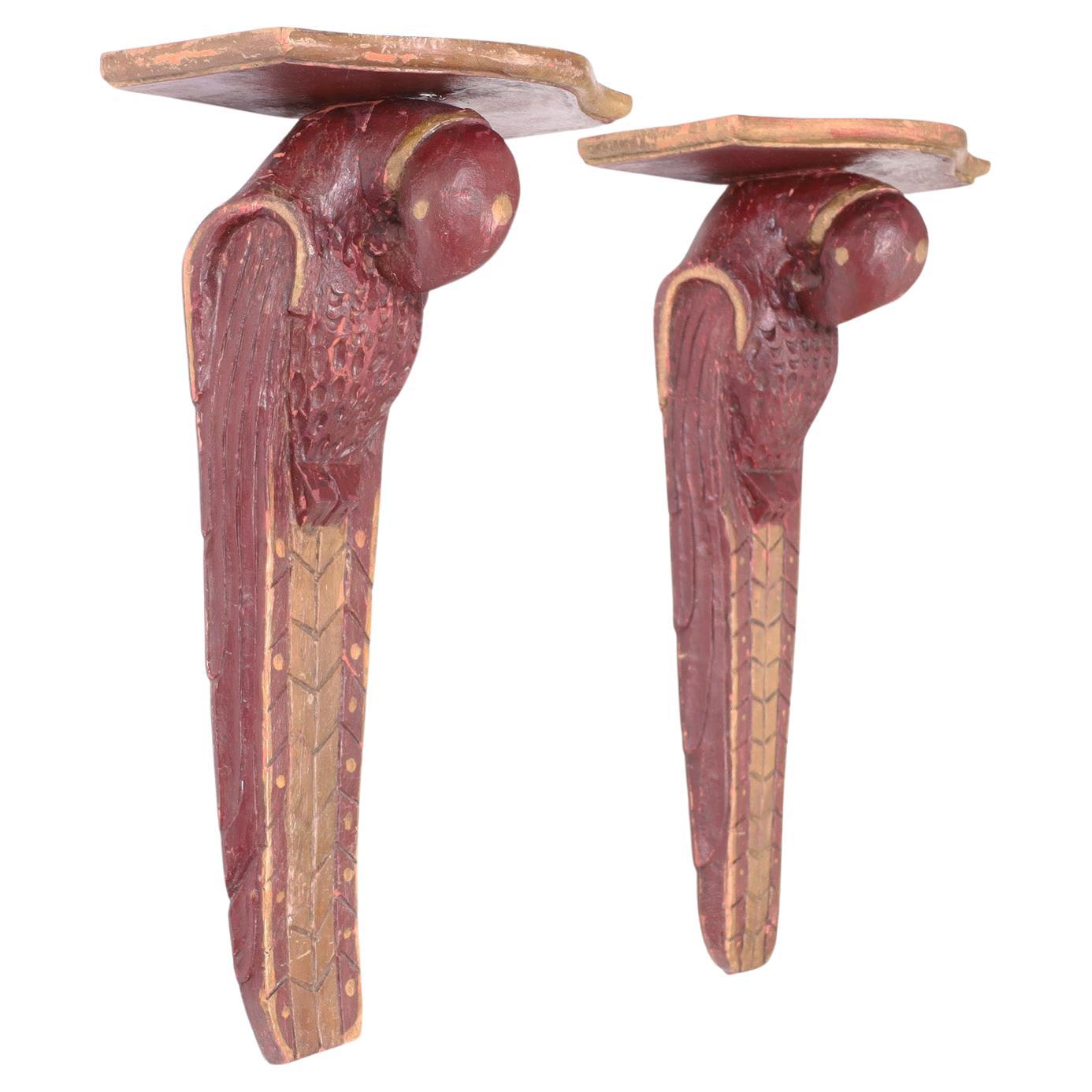 Antique Anglo Indian wall brackets carved from indigenous hardwood in a stylized naive art deco form retaining their original paint now worn.