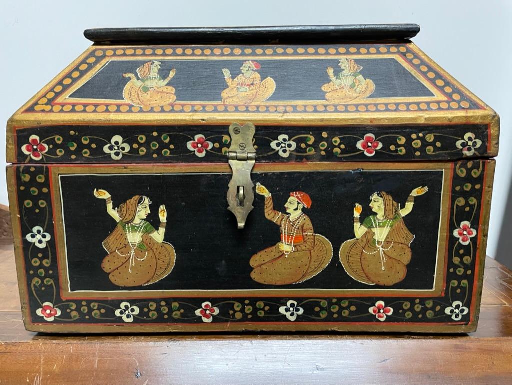 Very decorative hand painted in the Anglo-Indian style. Painted back and gold with each framed panel filled with female dancers and male flower bearing suiters. A colorful and fun, as well as useful addition to any interior. 
Measures: 14 inches