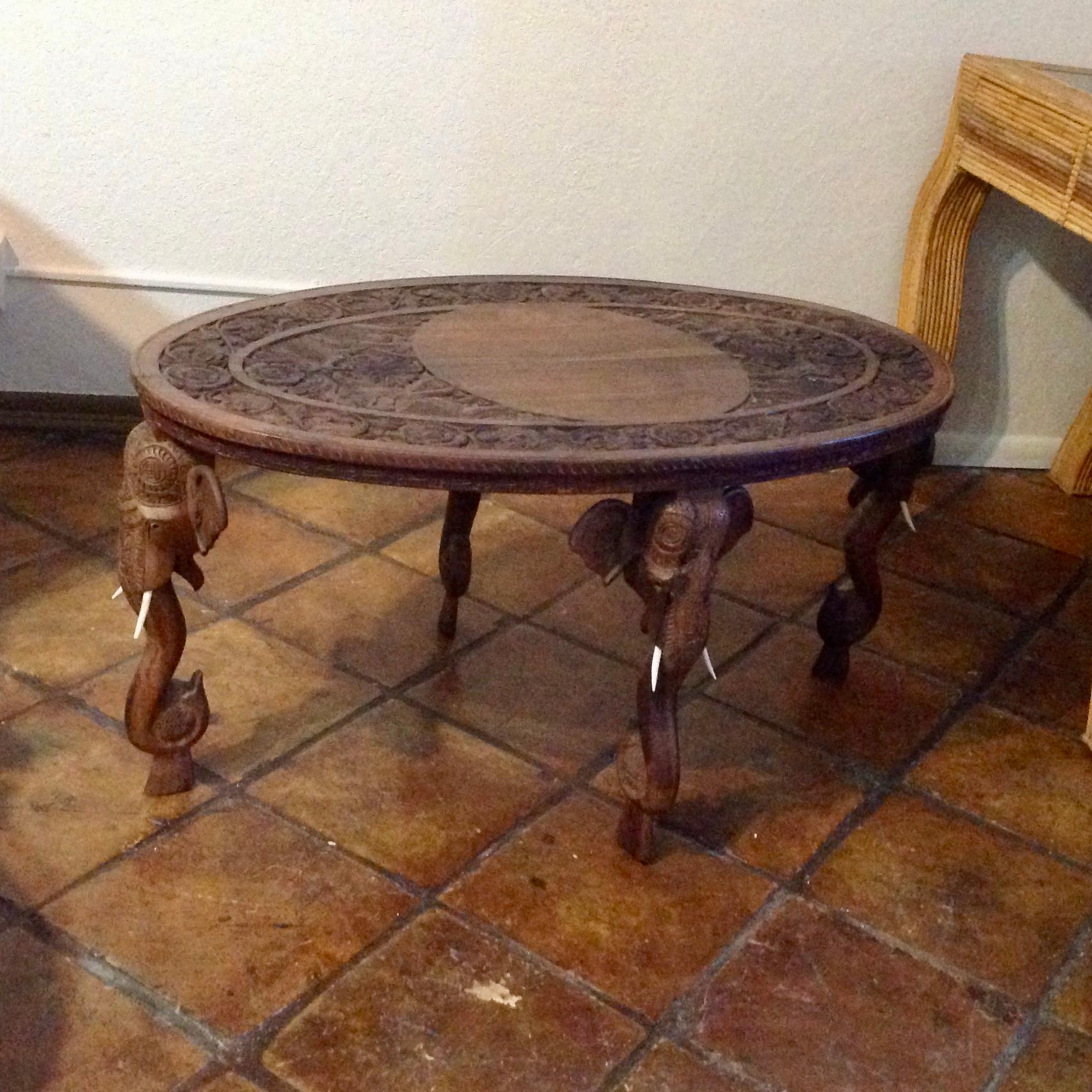 Exceptional carved hard wood with 4 elephant motif legs and
carved full figured elephants accenting the top.
Generously scaled and sharply detailed.