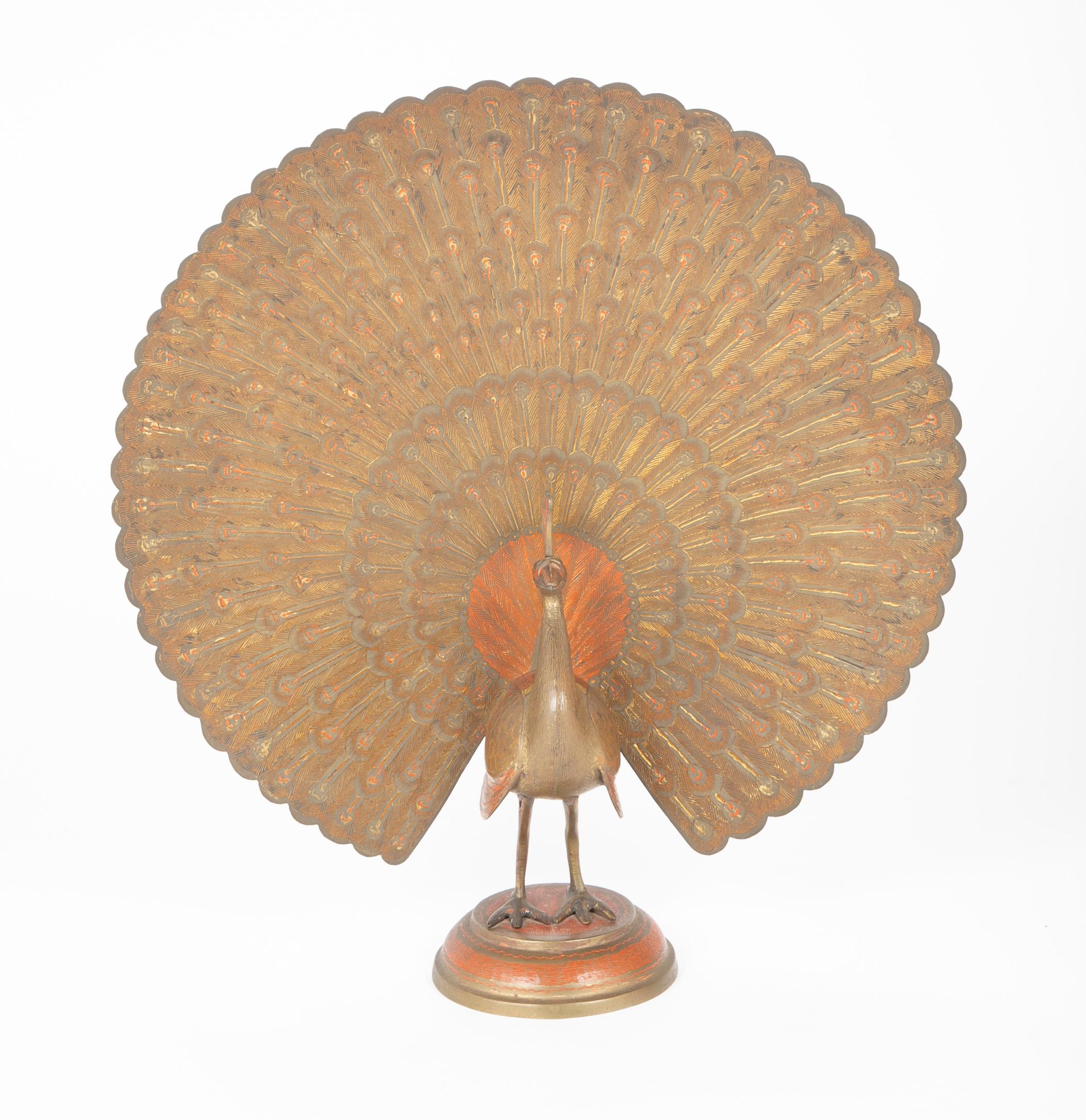 Beautifully rendered etched brass peacock, showing his feathers in full regalia. The surface highlighted with gold and orange paint. An exceptional decorative piece, bringing joy to any room. 
Nice scale at 21 inches high.
 