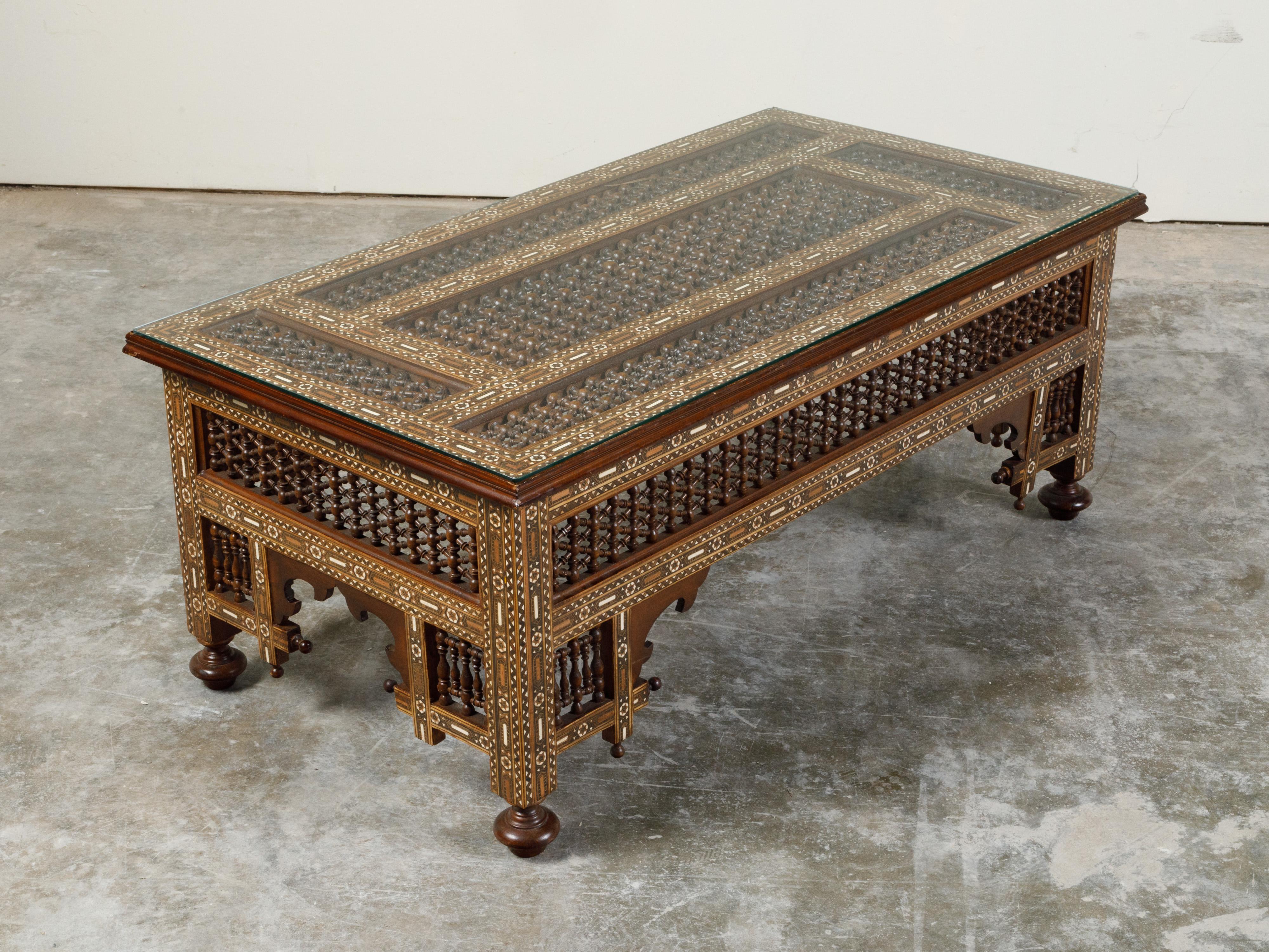 Anglo-Indian Glass Top Coffee Table with Mother of Pearl Inlay and Turned Motifs In Good Condition In Atlanta, GA
