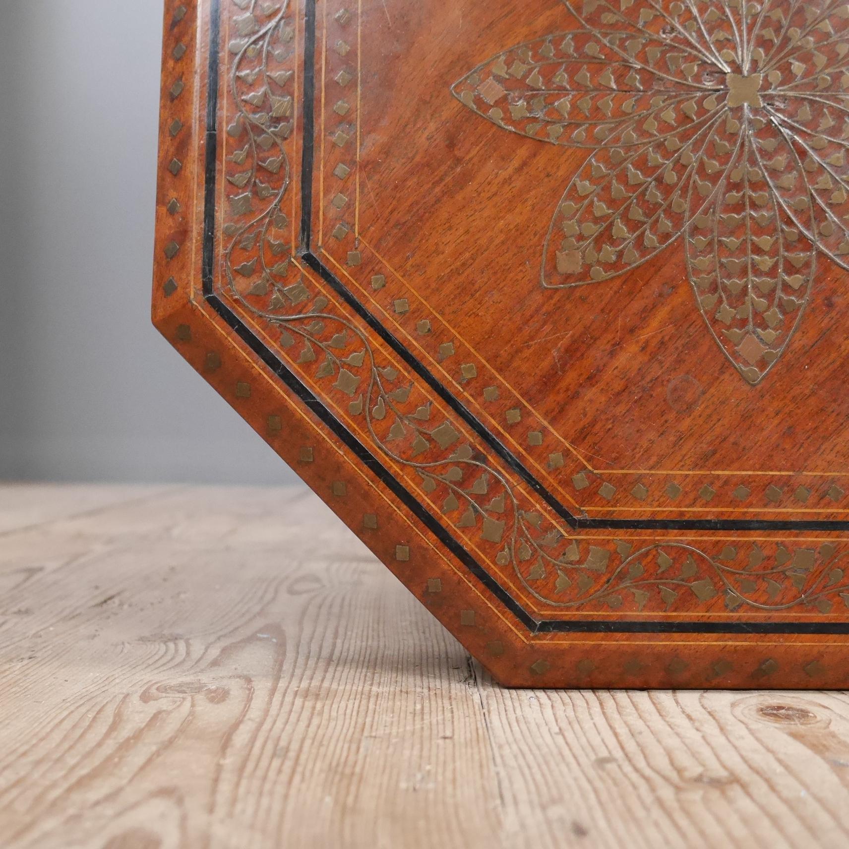 A wonderful turn-of-the-century Anglo-Indian Hoshiarpur table.
A good honest example, in solid hardwood with some nice detail with both the folding base and top inlaid with brass, copper & ebony.
circa 1900
Wear commensurate with age, with a few