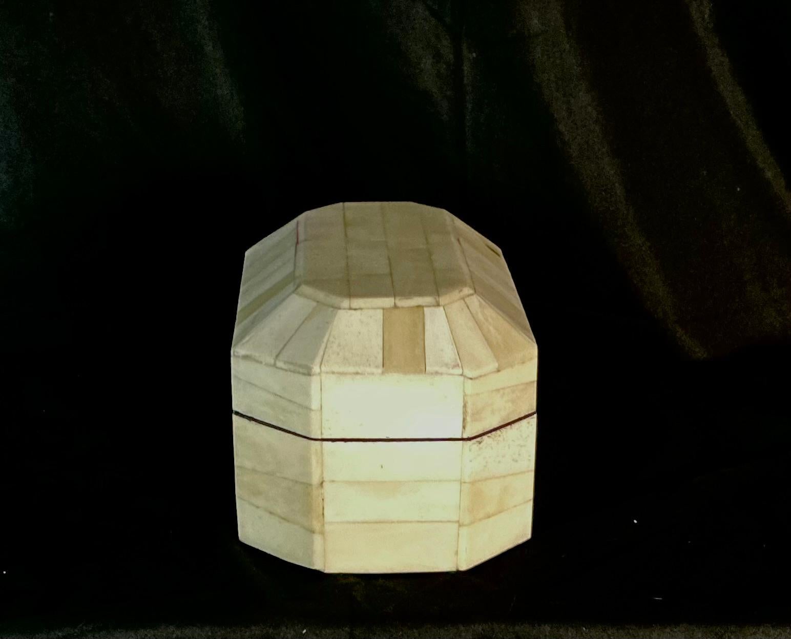 Mid-20th Century Anglo-Indian Inlaid Bone Jewelry or Trinket Box. Box features hand-cut bone tiles arranged in a paneled pattern, giving the piece a subtle textural appeal and natural variation in tone. The hinged lid opens to reveal a sleek black
