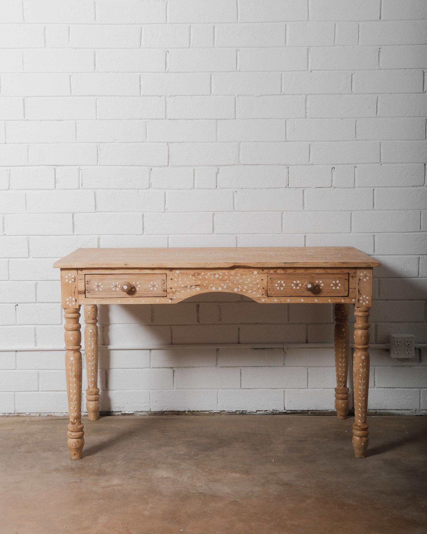 This Anglo-Indian Inlaid Resin Desk is a true masterpiece of hand-applied craftsmanship. Featuring two drawers for storage, it effortlessly combines functionality with beauty, making it a stunning addition to any office. Adorned with intricate