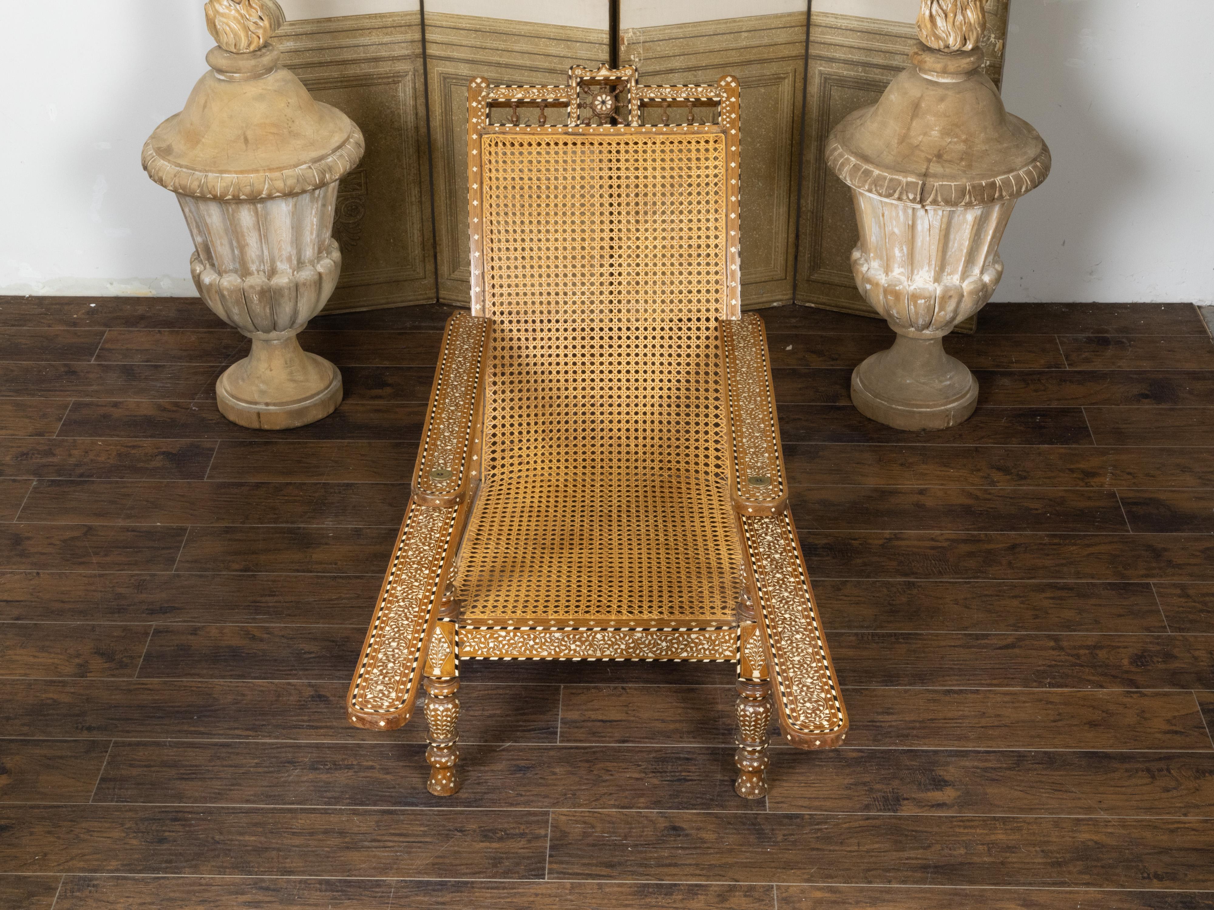 Cane Anglo-Indian Inlaid Plantation Chair with Scrolling Foliage and Extending Arms For Sale