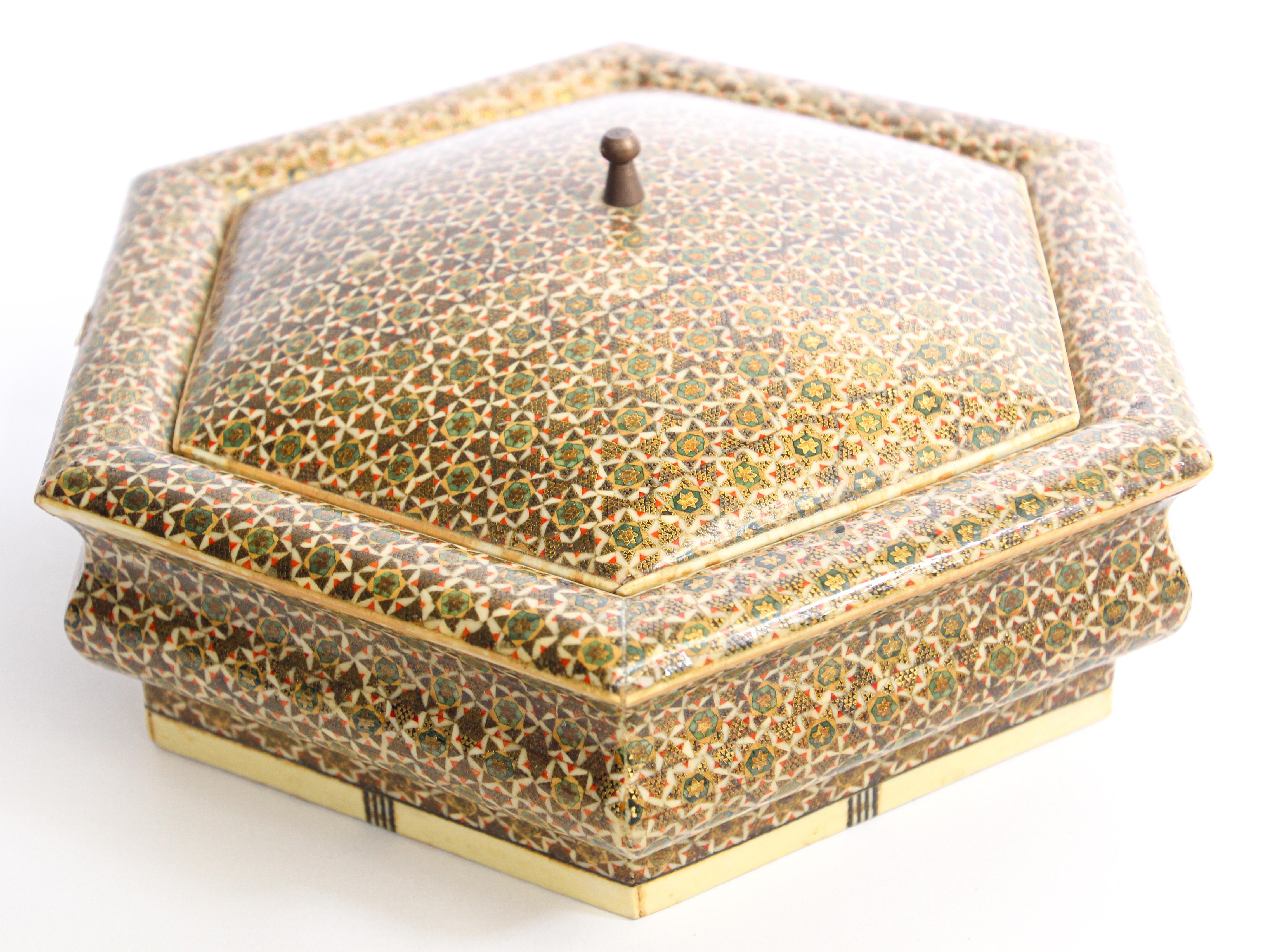 Anglo Indian Moorish style micro mosaic inlaid jewelry box with lid.
Intricate inlaid Anglo Indian box with floral and geometric Moorish Sadeli design in an octagonal shape form with micro mosaic marquetry, very fine artwork.
Museum collector piece