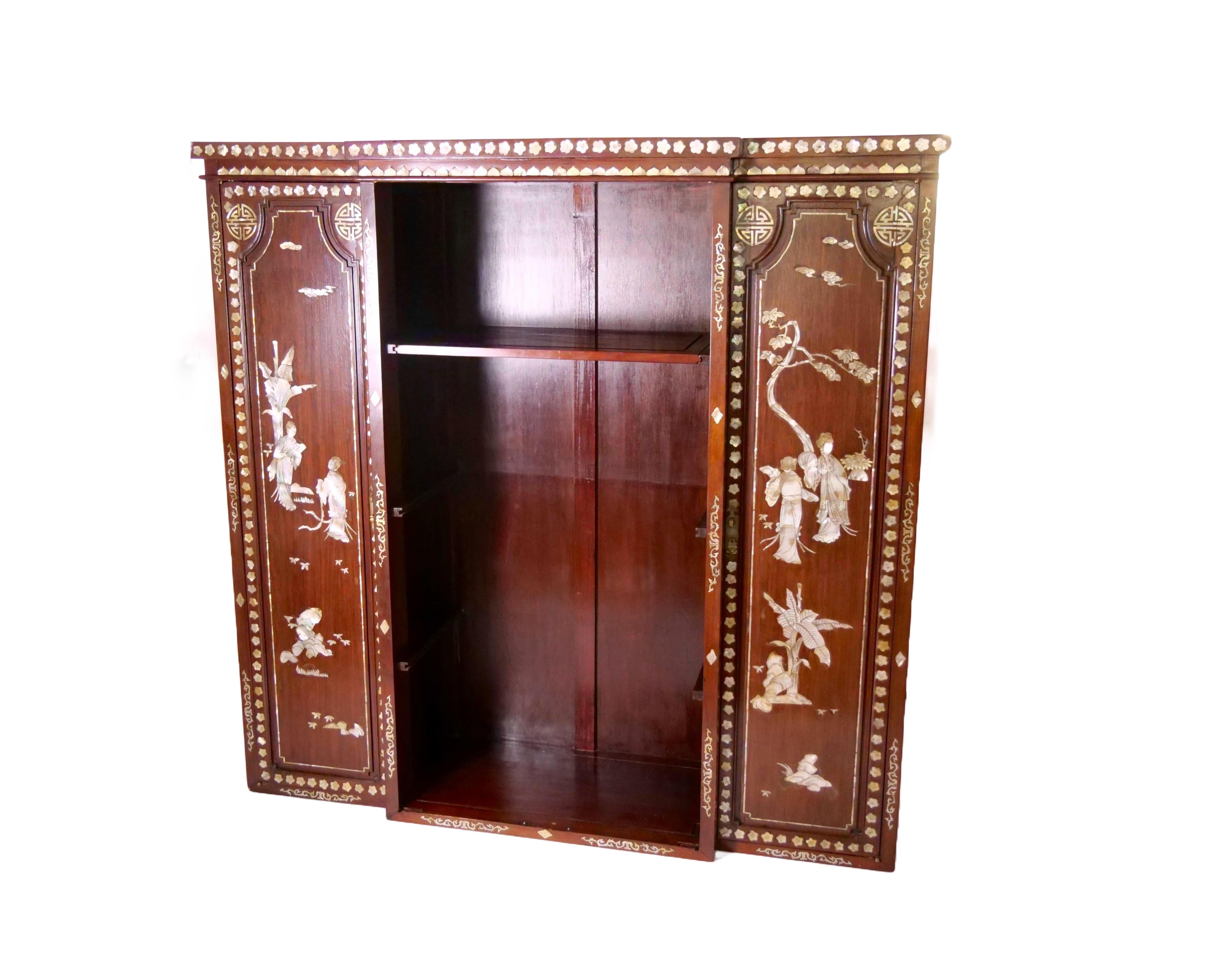 Step into the enchanting world of Anglo-Indian craftsmanship with this captivating Mother-of-Pearl Inlaid Two-Part Bookcase/Display Cabinet, showcasing the exquisite beauty of early 20th-century Noorish style.
Adorned with intricate mother-of-pearl