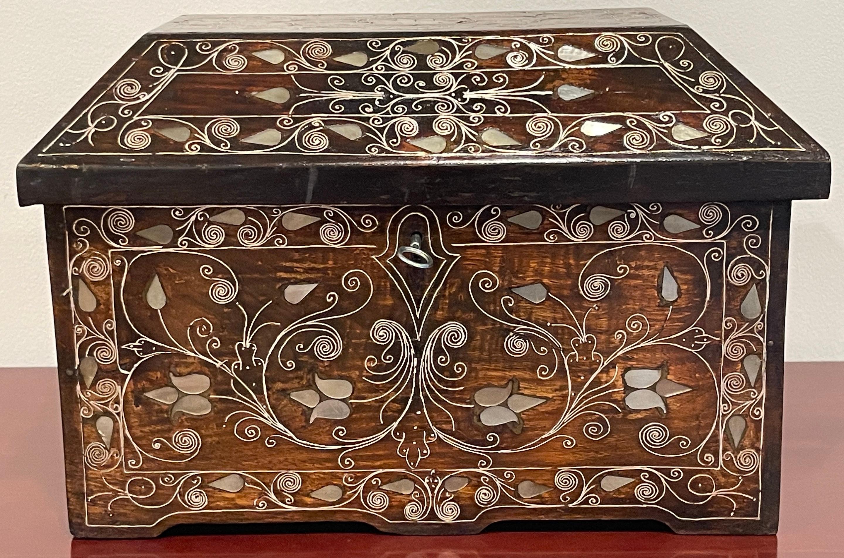 Anglo-Indian Mother of Pearl Inlaid Trunk/Box 
India, Lat 19th Century 
Either a diminutive trunk or a large table box, the size and scale is impressive. This work crafted in rich warm hardwood,  shimmers with the profuse inlay including mother of