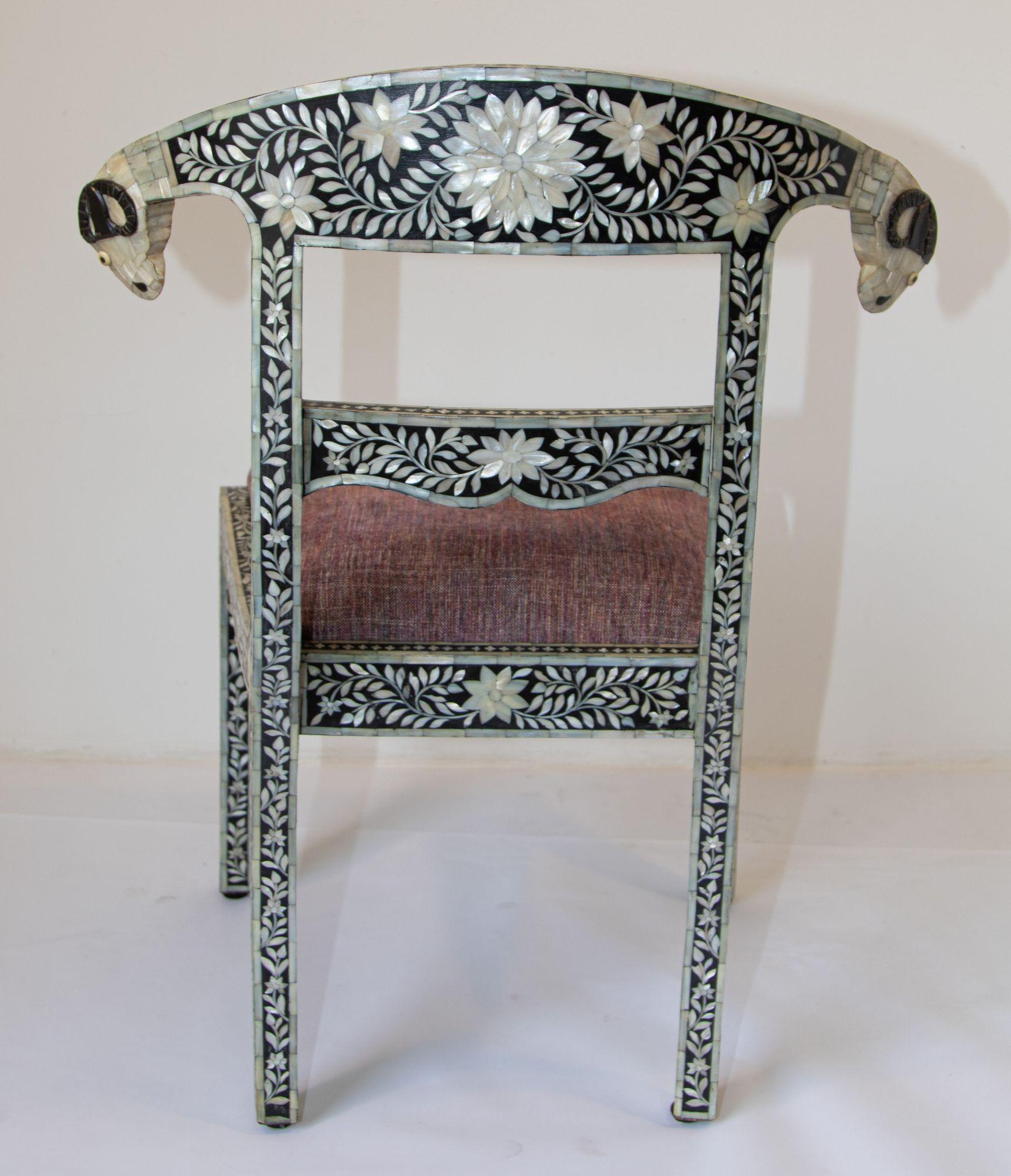 Antique Anglo-Indian Mughal Mother of Pearl Inlaid Side Chair with Ram's Head.
very collectable and rare to find we also have the armchairs available.
Anglo-Indian Mughal black and white mother of pearl and bone inlaid collectable chair with ram