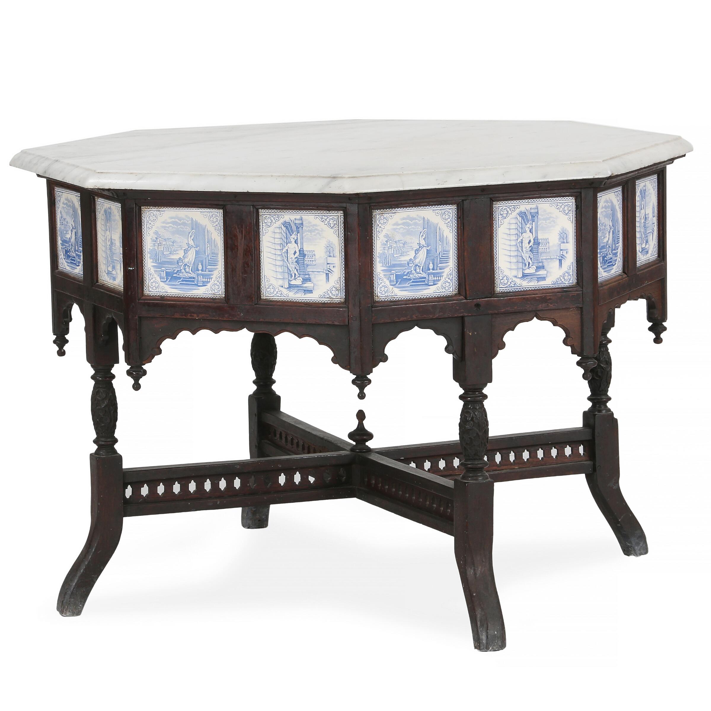 Marvelous Anglo-Indian octagonal center table in carved hardwood set with multiple faience tiles in blue and white neoclassical designs and having an off-white, grey-grained marble top.