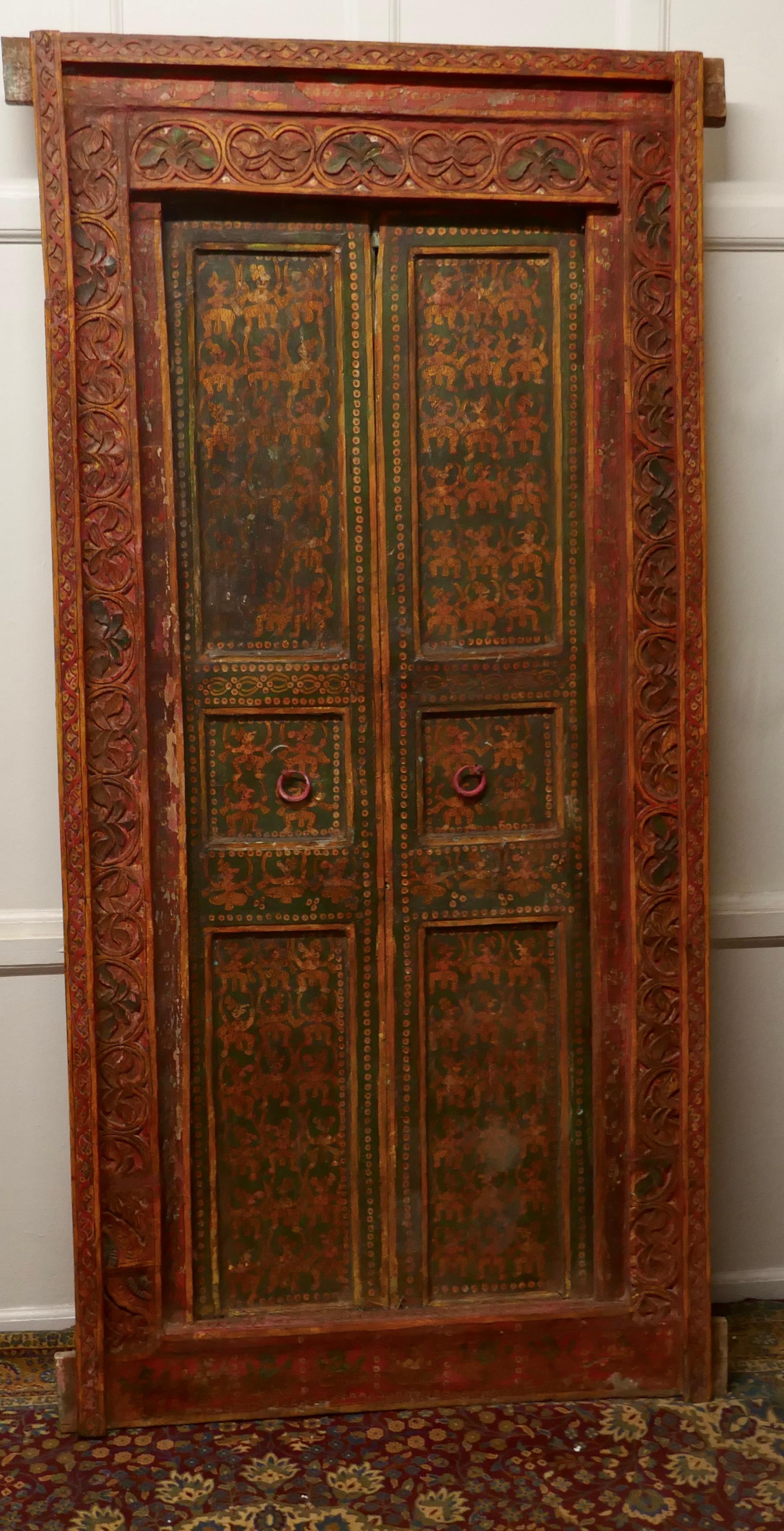 Anglo Indian Painted Doors in Original Frame, Wall Art

These beautiful wooden doors would look fabulous on a wall as decoration or relocated in a doorway
The panelled doors come in their original Carved Frame they have been fixed in the closed