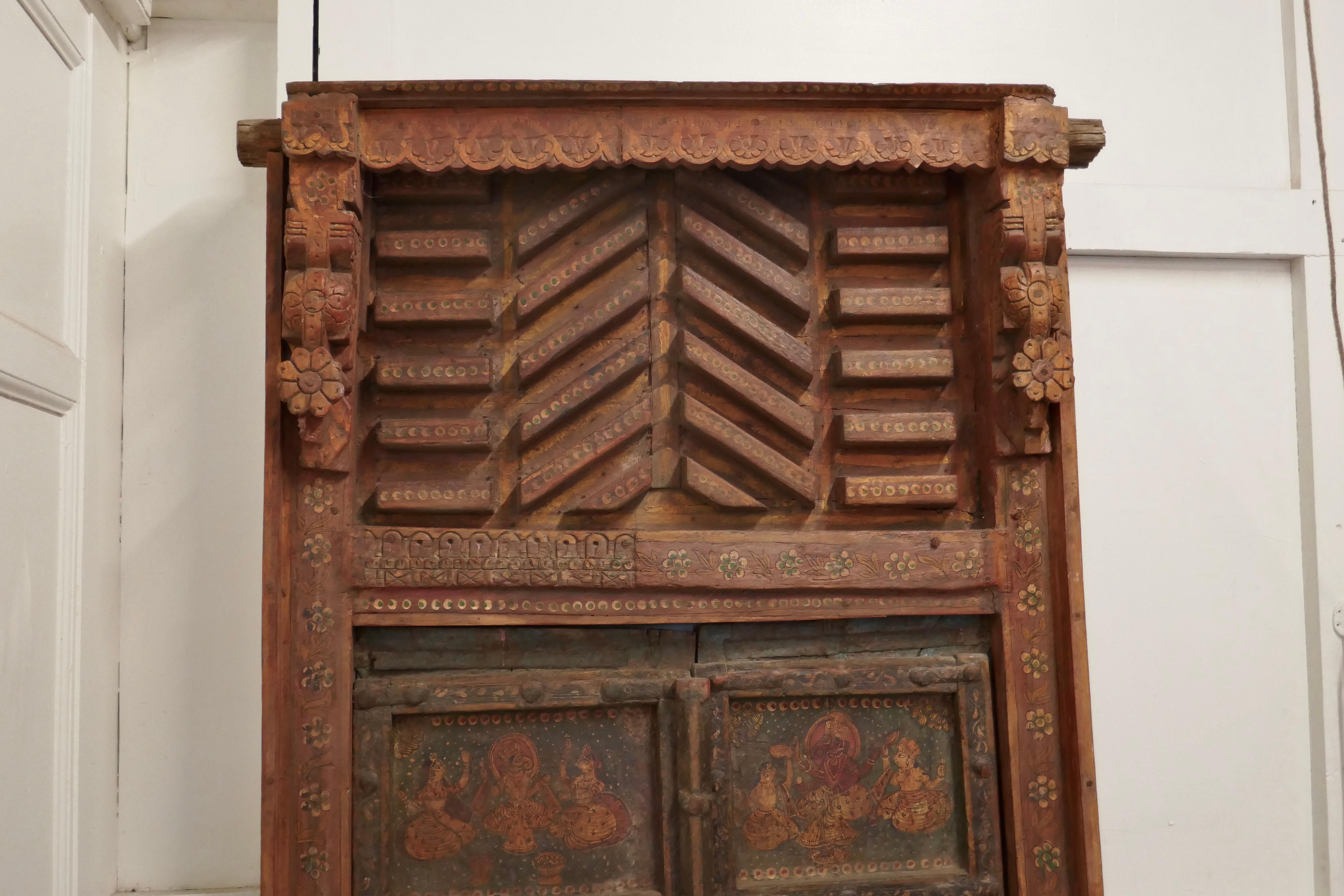 Anglo Indian painted doors in original frame, Wall Art

These beautiful wooden doors would look fabulous on a wall as decoration or relocated in a doorway
The panelled doors come in their original Carved Frame they have been fixed in the closed