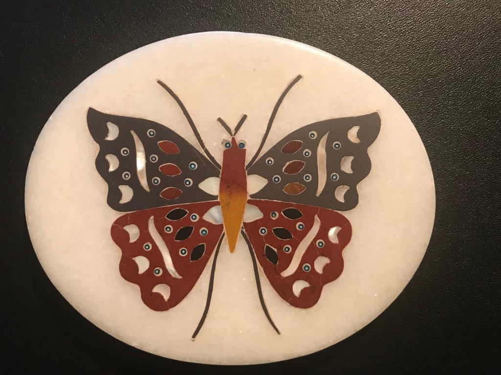 White marble paperweight with beautiful colored burnt orange and greenish gray marble inlay with mother of pearl highlights in the form of a butterfly. Mid-20th century Anglo-Indian, purchased by the previous owner in Agra in the 1950s.