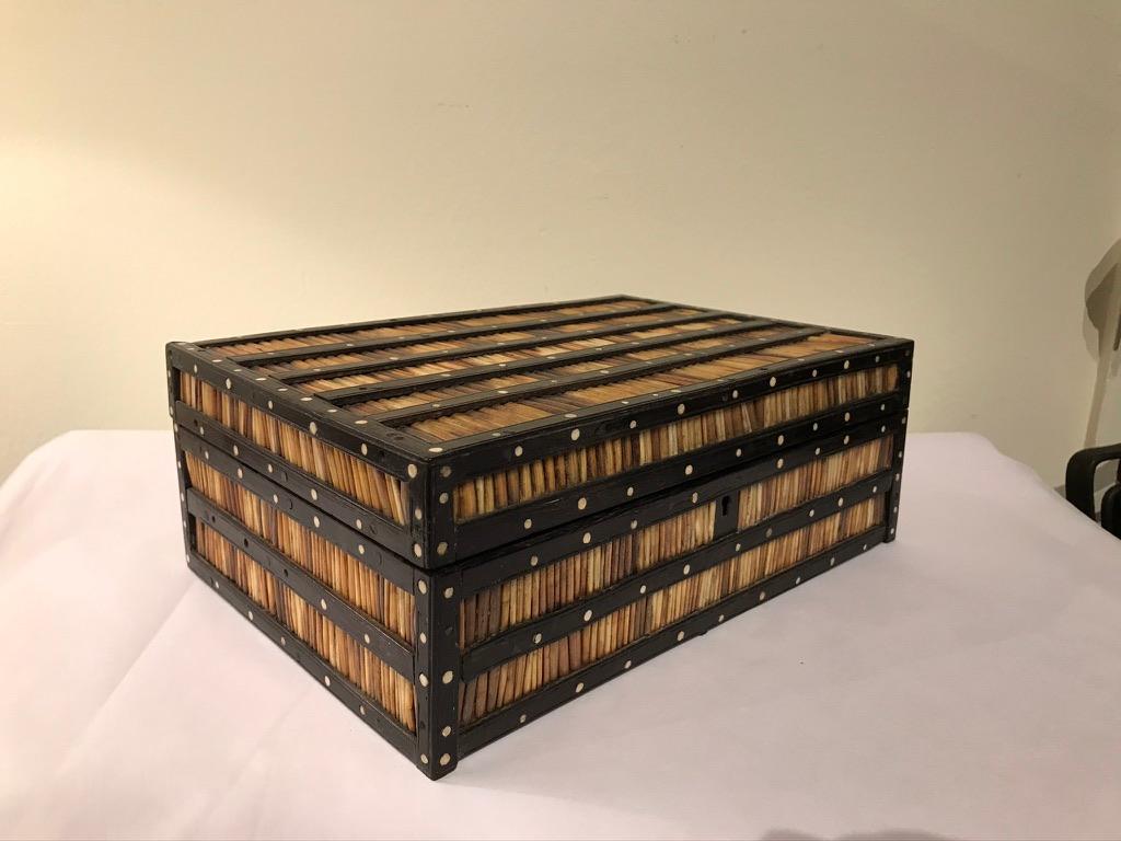 Anglo-Indian box with porcupine quills framed by rosewood with circular bone inlay. A good size rectangular box of this type. Made in colonial Ceylon, present day Sri Lanka.