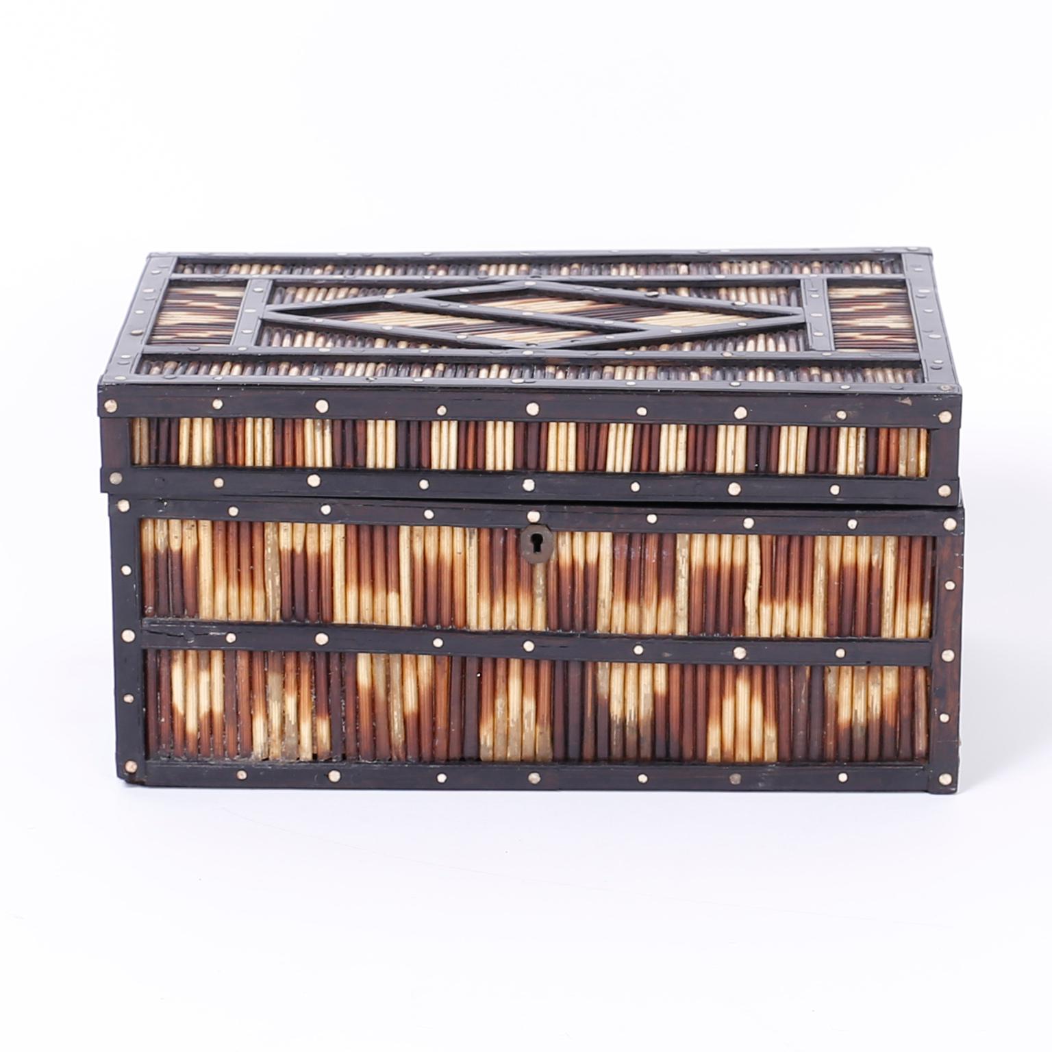 Antique Anglo Indian box crafted in ebony and porcupine quills and decorated with inlaid bone dots. The interior is felt lined.