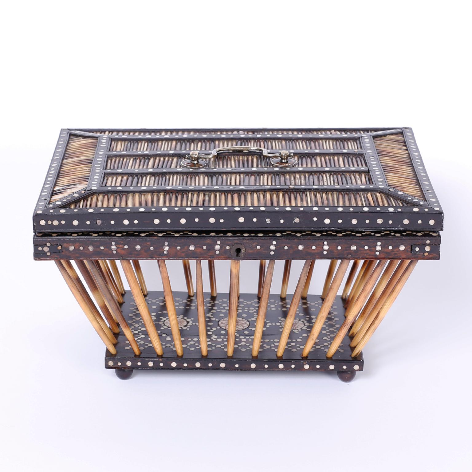 Refined Anglo Indian basket or cricket box intricately crafted with porcupine quills and ebony, decorated with bone dots and painted floral designs from the island of Ceylon.