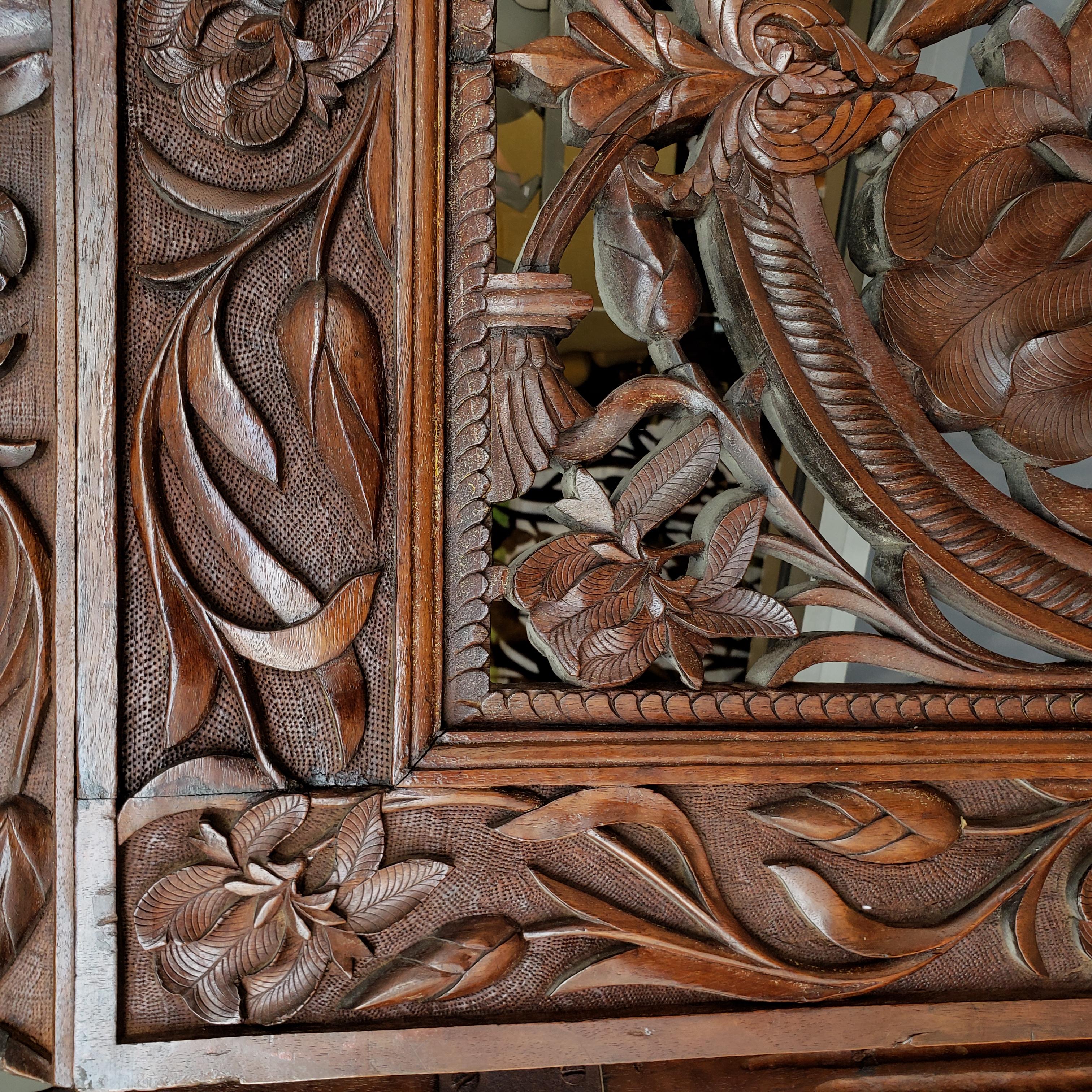 Absolutely stunning room divider.  Being most unusual with each panel depicting different plants and flowers.  Most likely made for the European market.  Incredibly well carved and carved on both sides with same designs.  