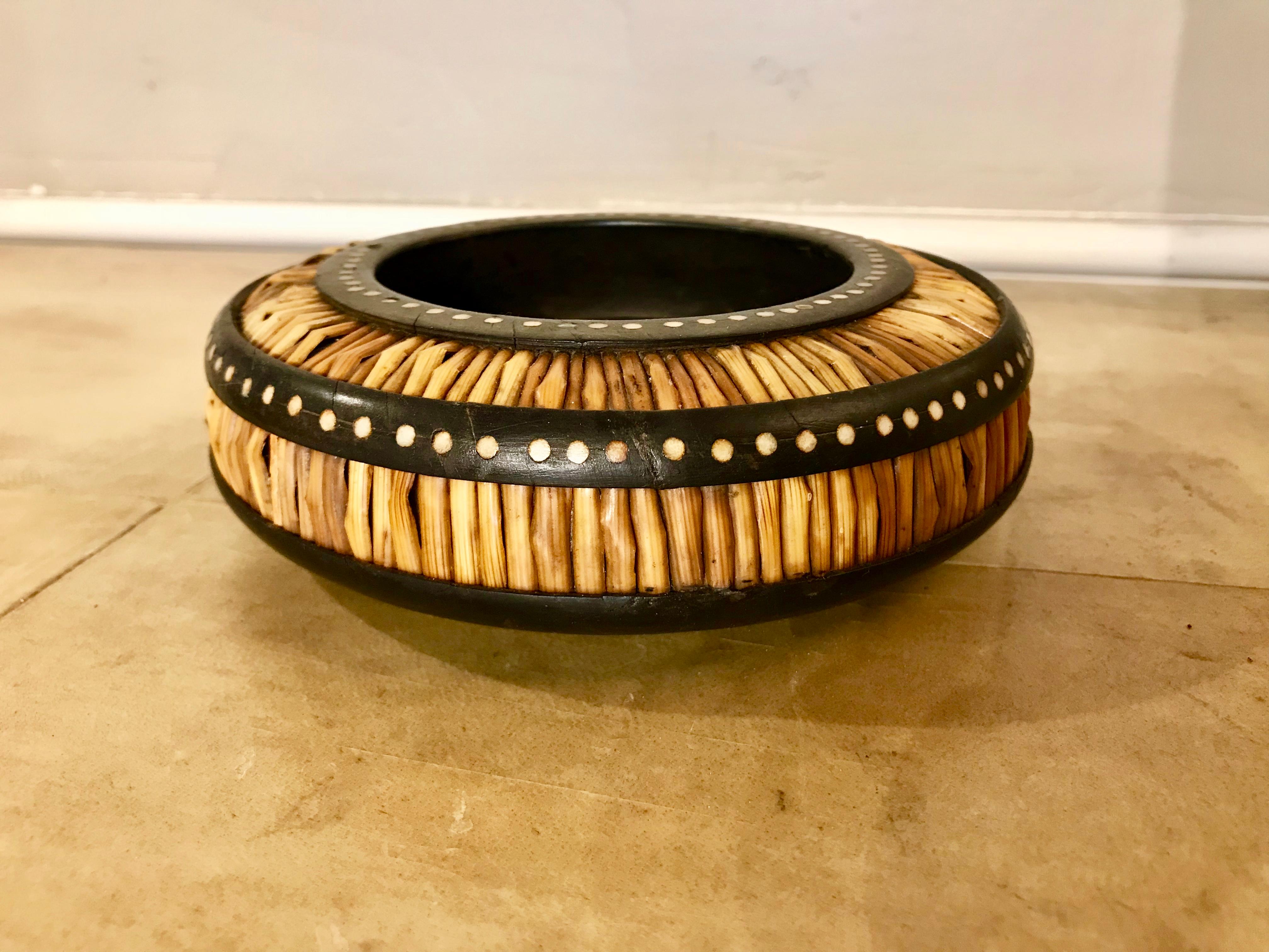 Anglo-Indian shallow bowl with porcupine quills framed by rosewood with circular bone inlay. Unusual form, will make a great key tray! Made in colonial Ceylon, present day Sri Lanka.
 