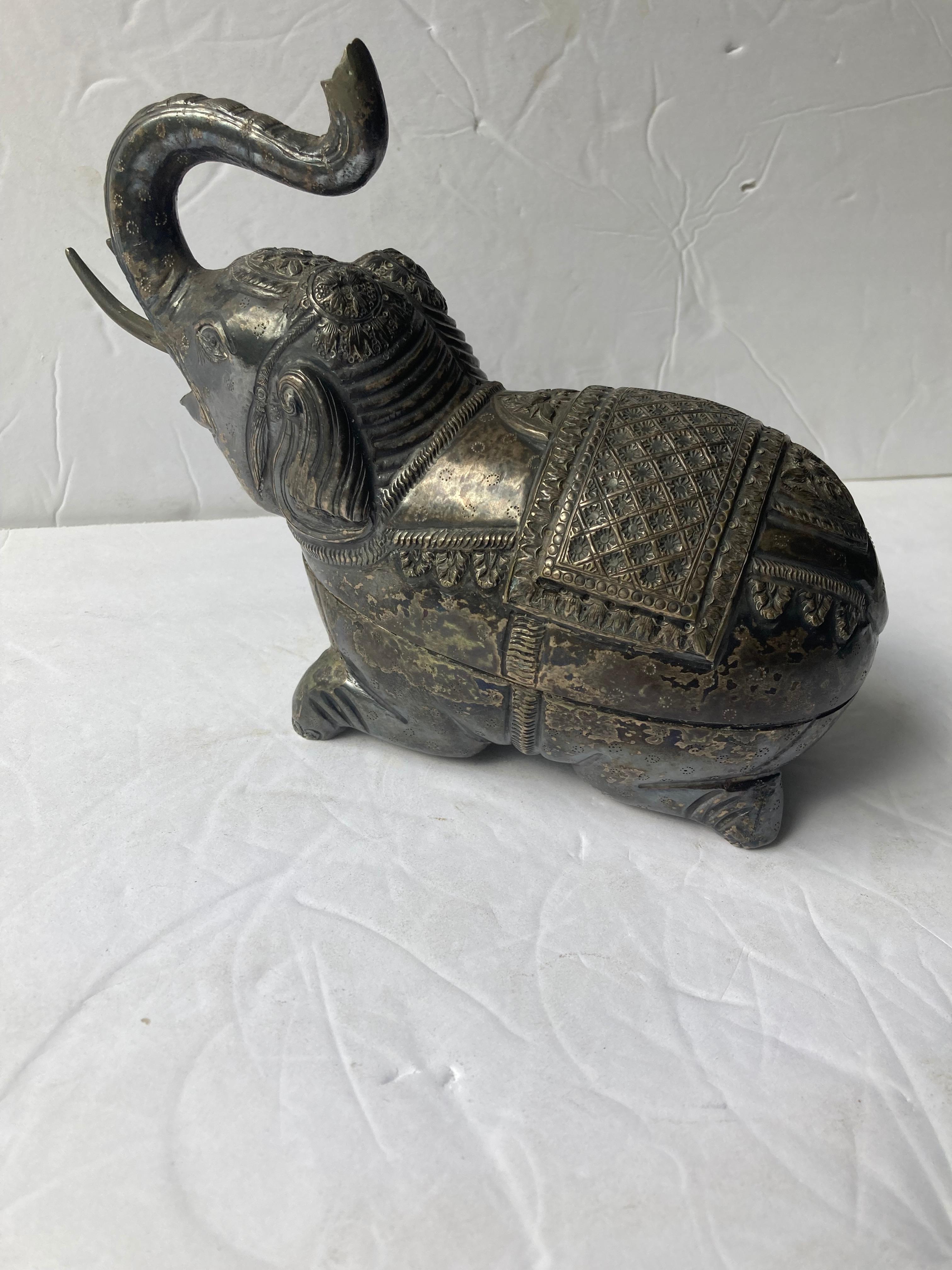 Beautiful silvered metal box of an elephant in a very traditional Anglo -Indian craft, art. Has an amazing age patina in contrast with the inside, as shown.