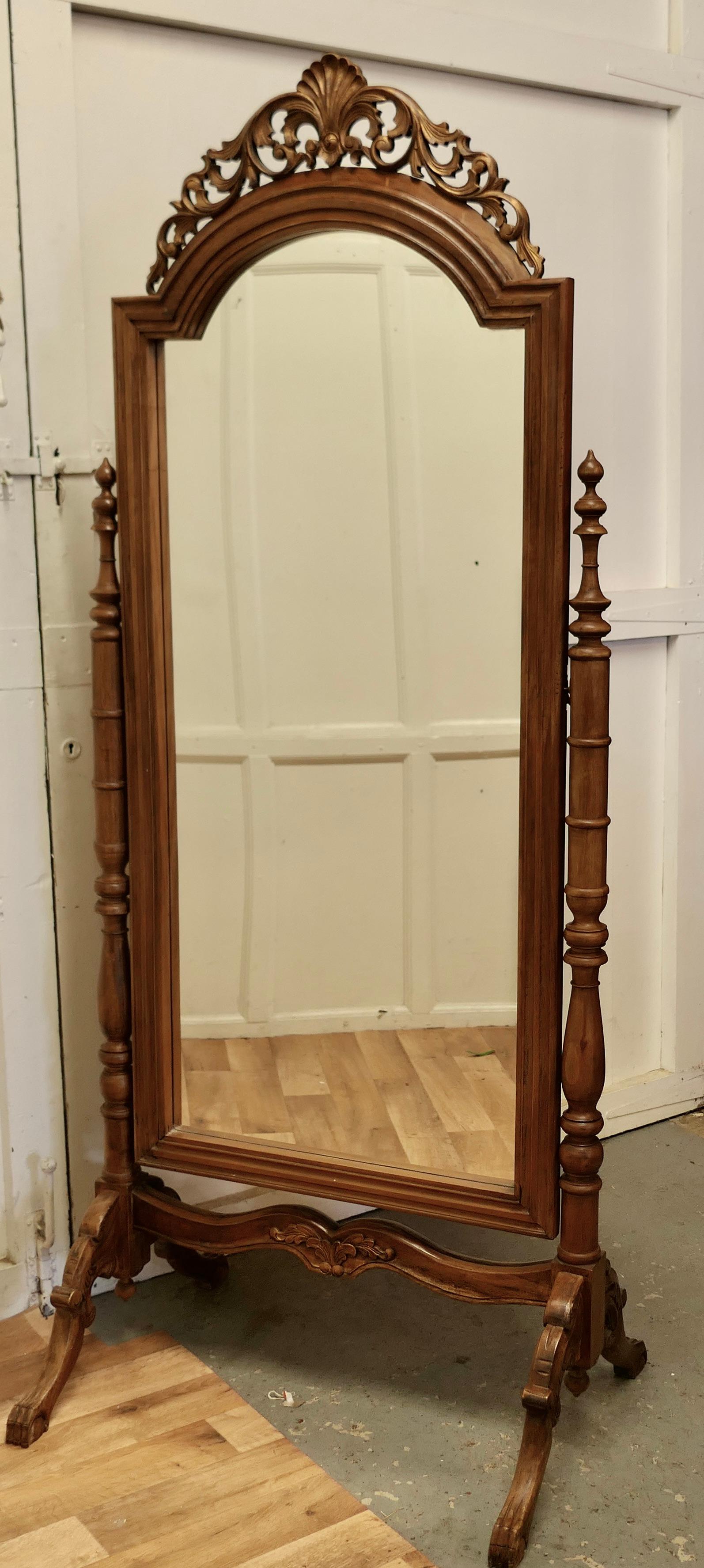 Anglo Indian Style Carved Cheval mirror

This lovely Mirror has a Shell and Acanthus carved top which has a hint of old gold decoration, it sits firmly in its stand and swivels for maximum advantage
The Stand has arching carved splayed feet with