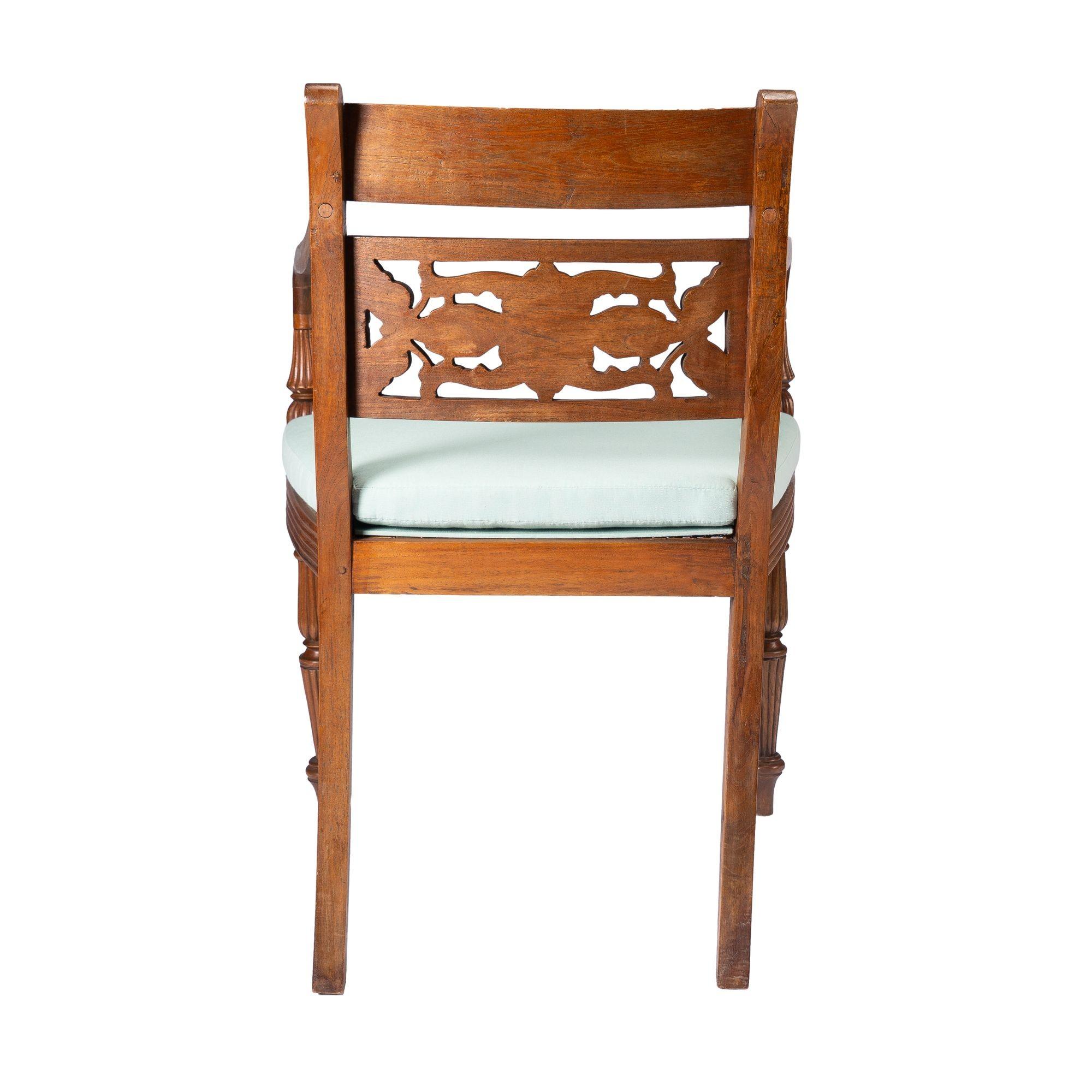 Anglo-Indian teak arm chair with caned seat and cushion, 1900-50 In Good Condition In Kenilworth, IL