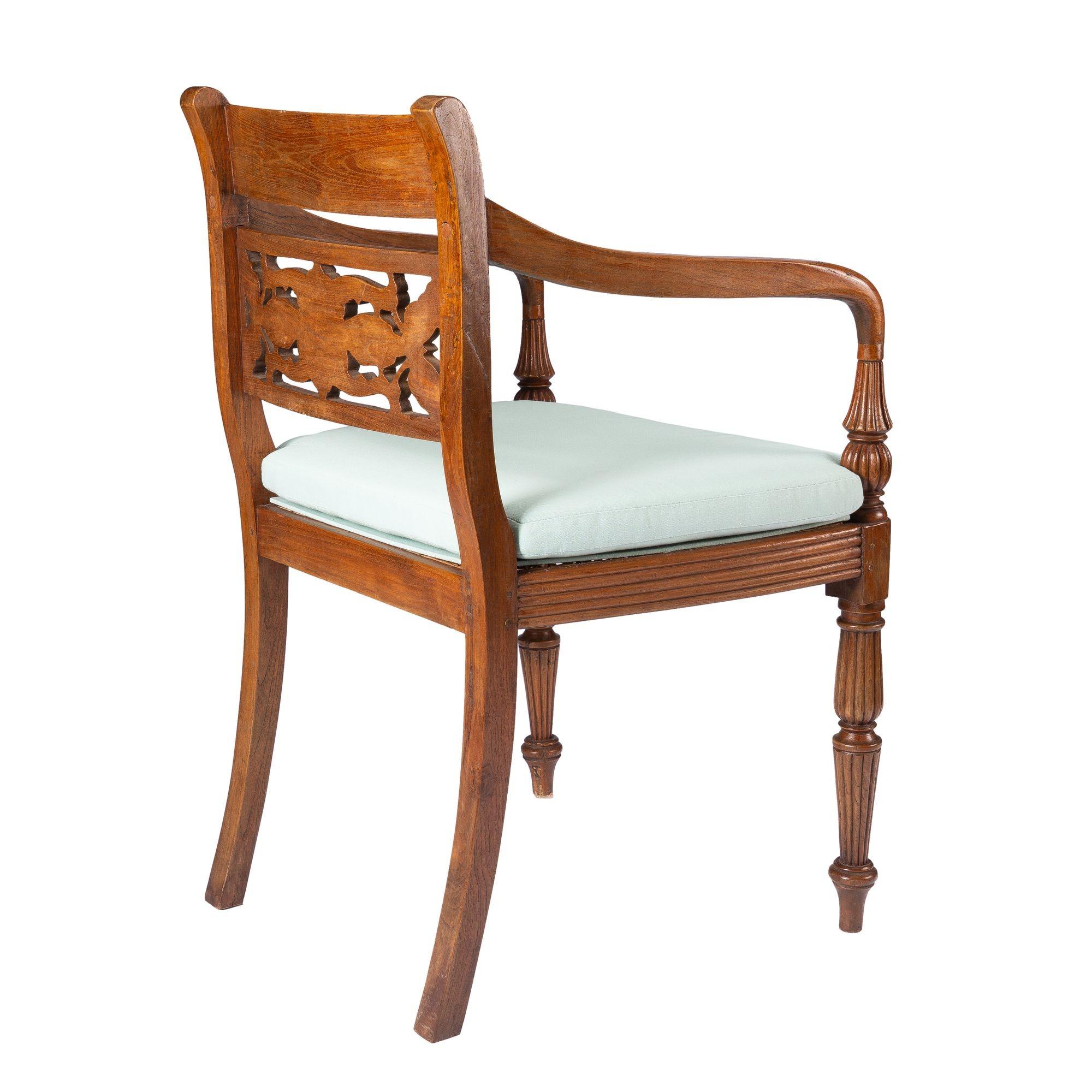 20th Century Anglo-Indian teak arm chair with caned seat and cushion, 1900-50