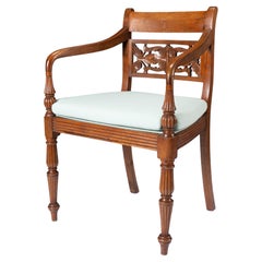 Anglo-Indian teak arm chair with caned seat and cushion, 1900-50