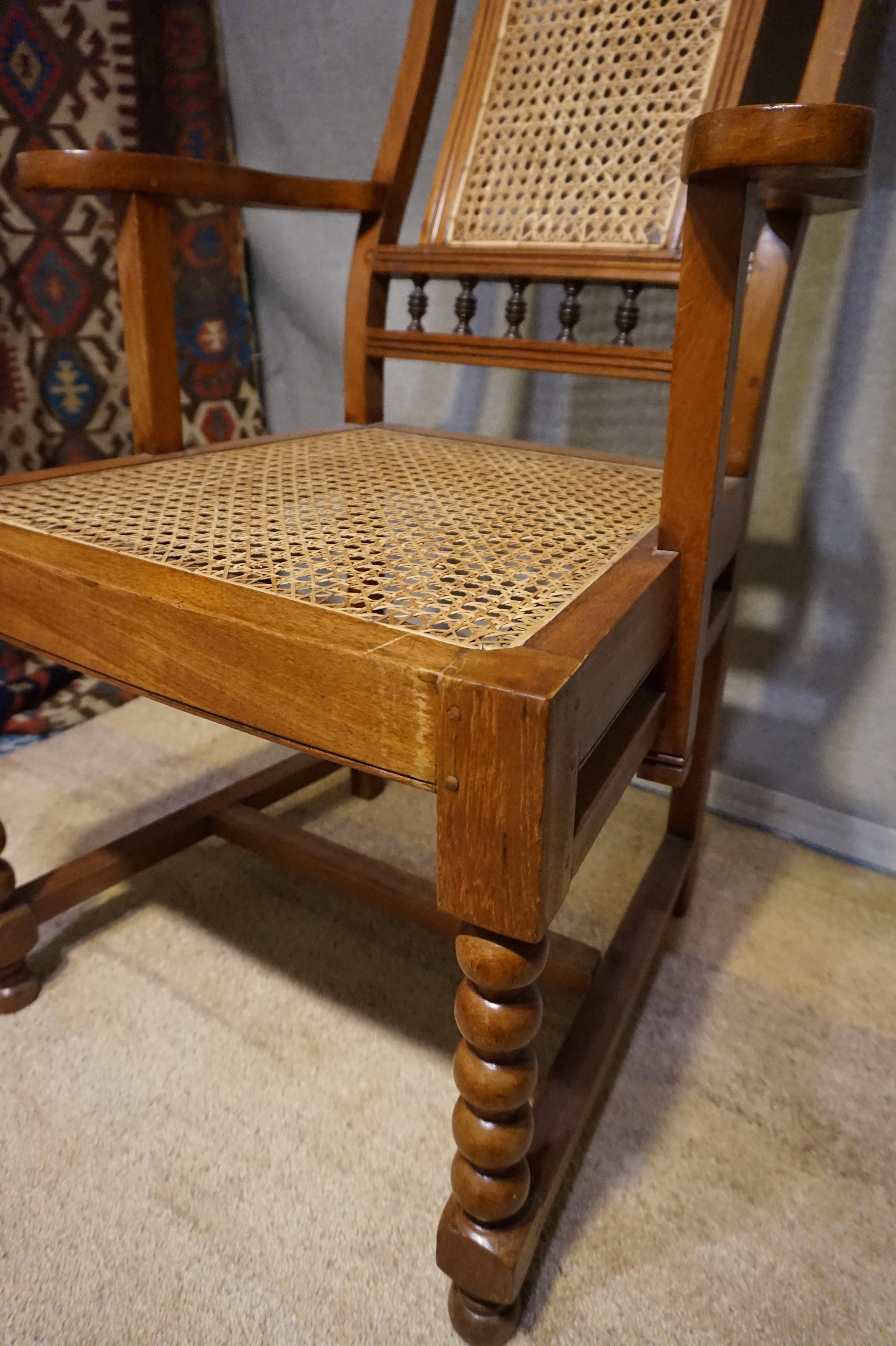 Anglo Raj Anglo-Indian Teak Rosewood Cane Armchair With Barley Twist Legs