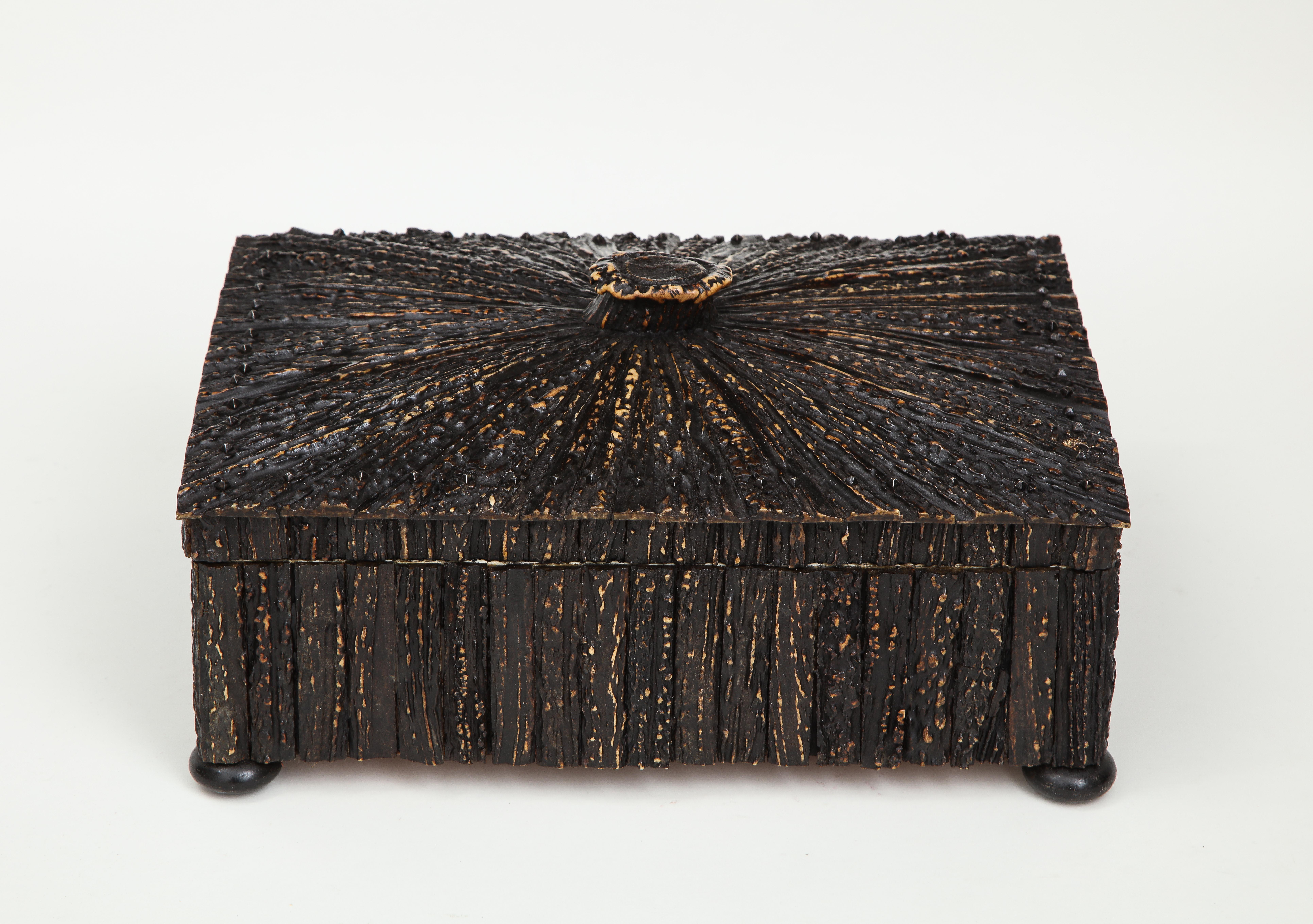 The sandalwood box veneered with antler (note that back is ebonized); opening to a green velvet-lined interior.