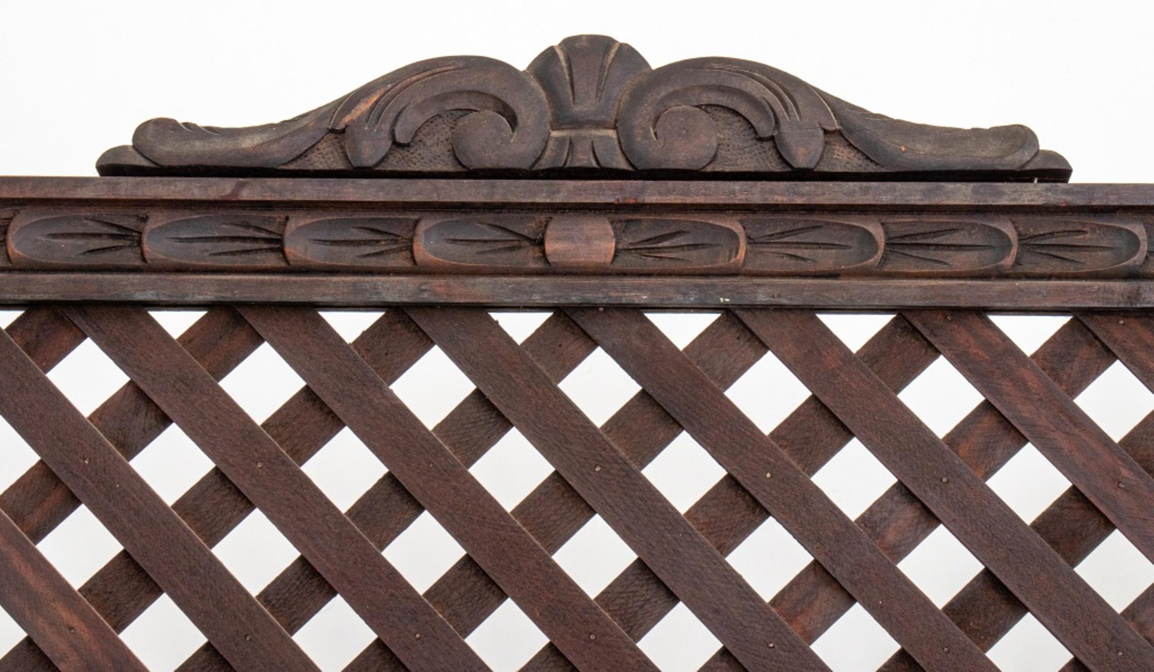 Anglo Indian wooden lattice three panel screen, each panel with scrolling crestrail and finials above a latticework upper register atop nine paneled segments with leaf-carved borders.

Dimensions: 70