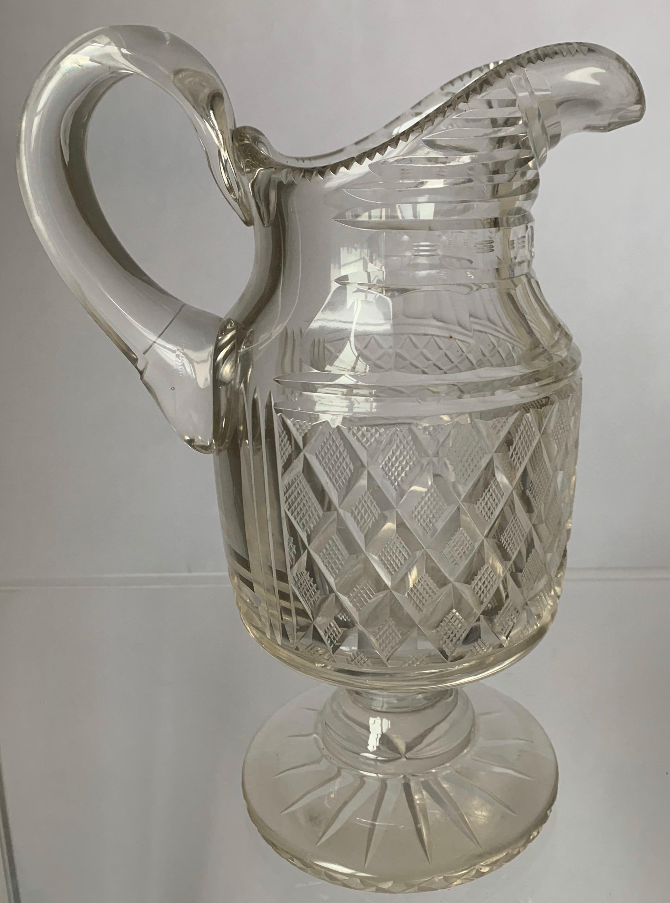 Anglo-Irish footed jug, circa 1820. Cut crystal with overall diamond cutting in excellent condition.