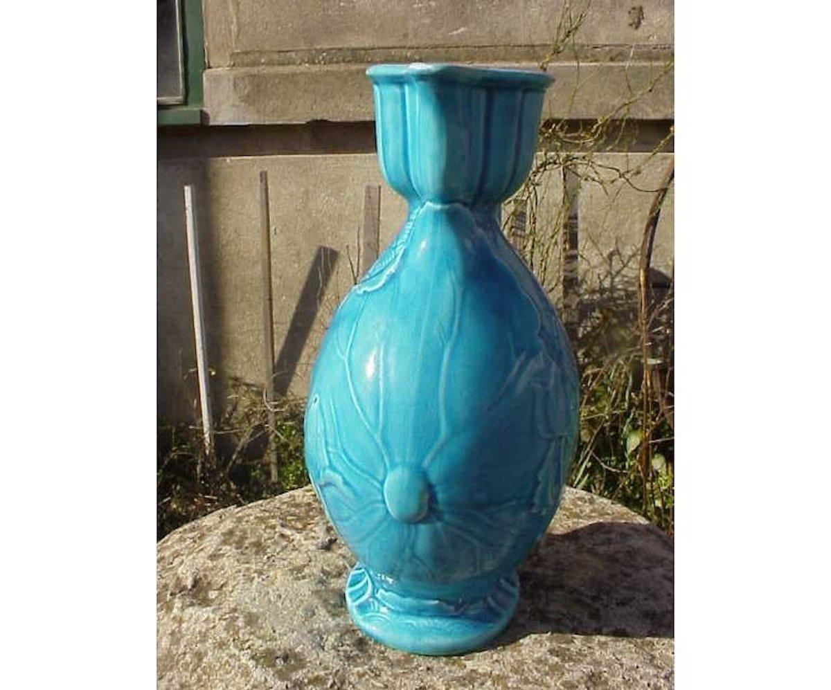 Minton, an Anglo-Japanese Majolica jug, modelled with lily pads and flowers, on a Japanese wave ground, overall turquoise glazed, impressed marks, date code for 1877.
Please note, there is a tiny chip missing from the spout