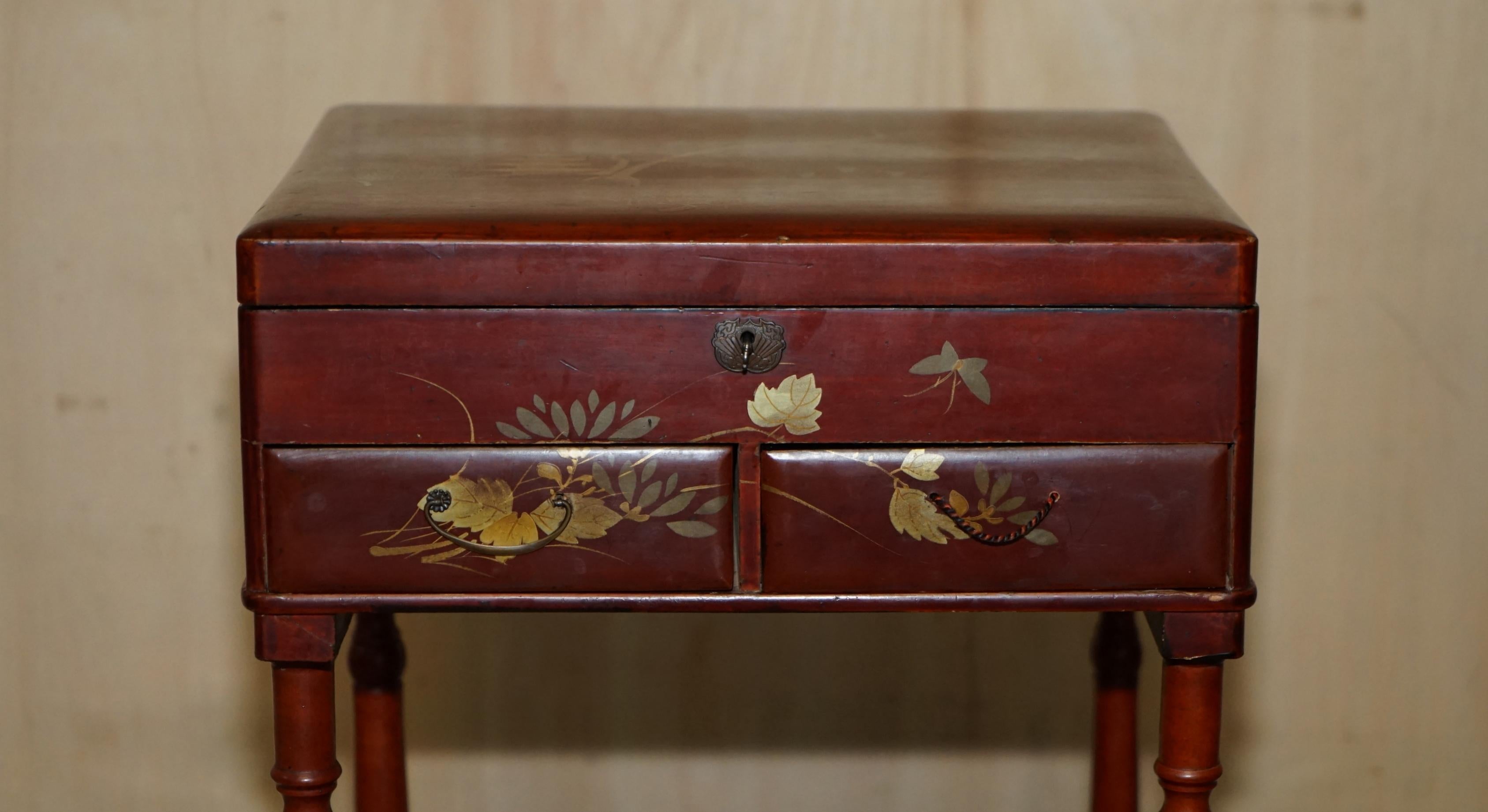 Anglo-Japanese Anglo Japanese Red Lacquer Sewing Table with Famboo Legs with Fitted Interior For Sale