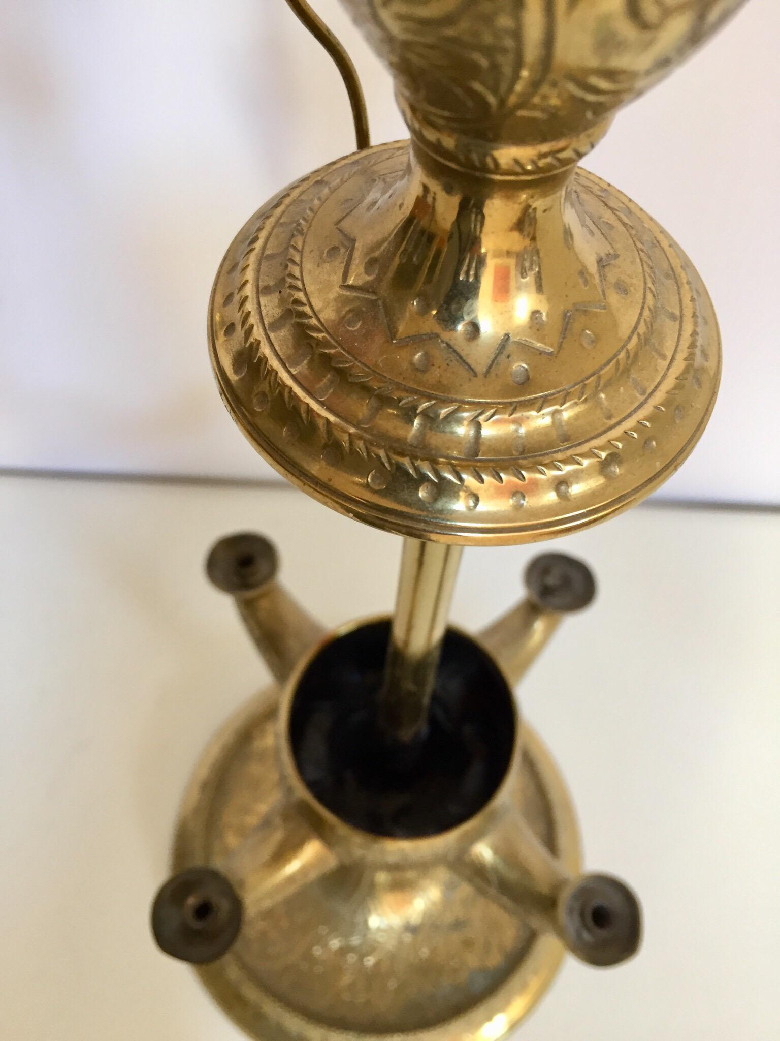 Anglo Raj antique, early 20th century brass Indian temple oil lamp.
Whale oil lamp with 4 wick burners.
Fantastic patina and great scale.
Used for sacred ceremonies in temples or at home.
The brass base is heavily carved with intricate floral