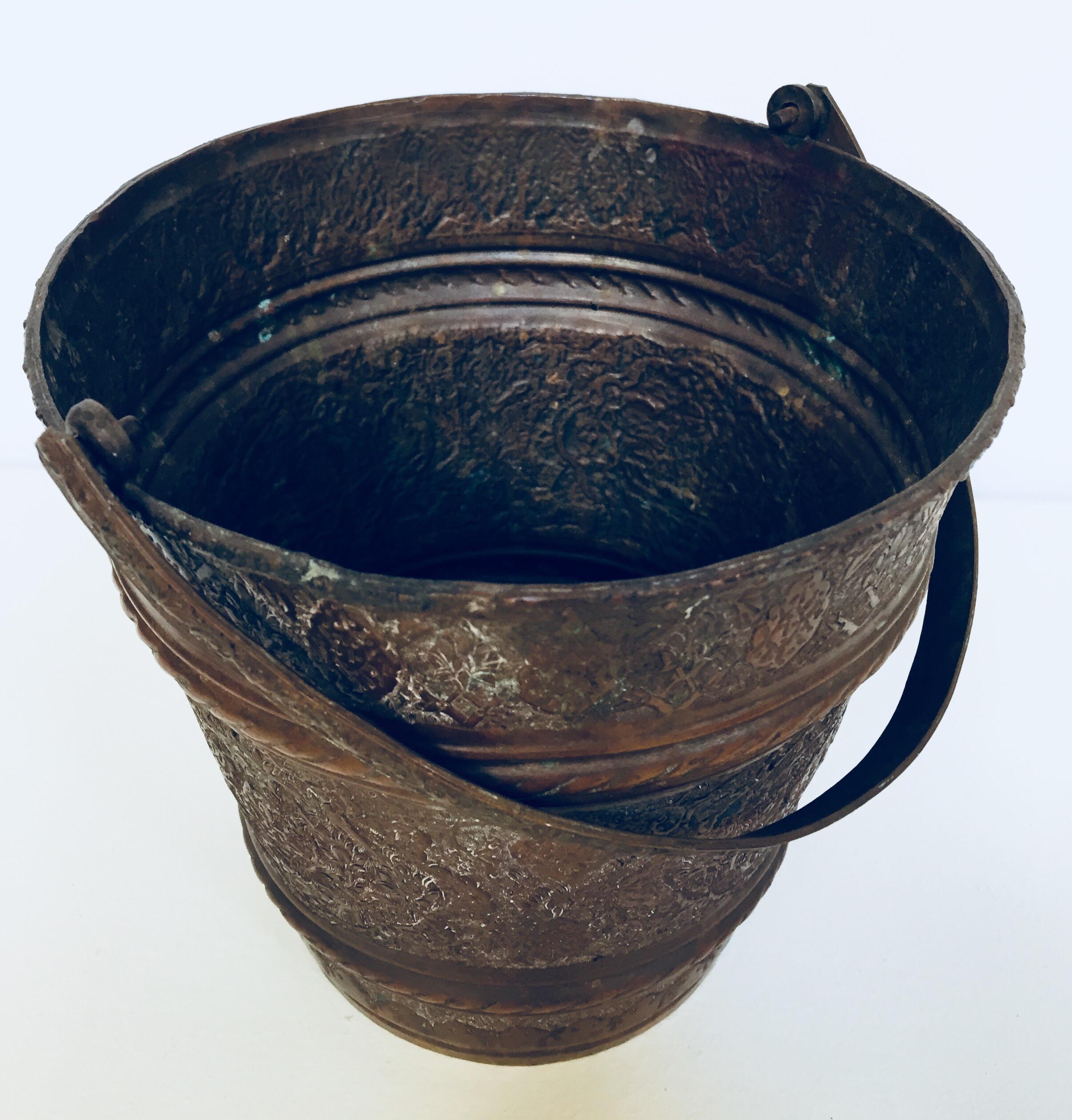 19th century Anglo Raj Moorish Mughal bronzed handcrafted metal copper pot vessel.
Originally used to carry water, this hand-hammered metal vessel from India has authentic texture, wonderful patina, and great form and character.
Great patina on