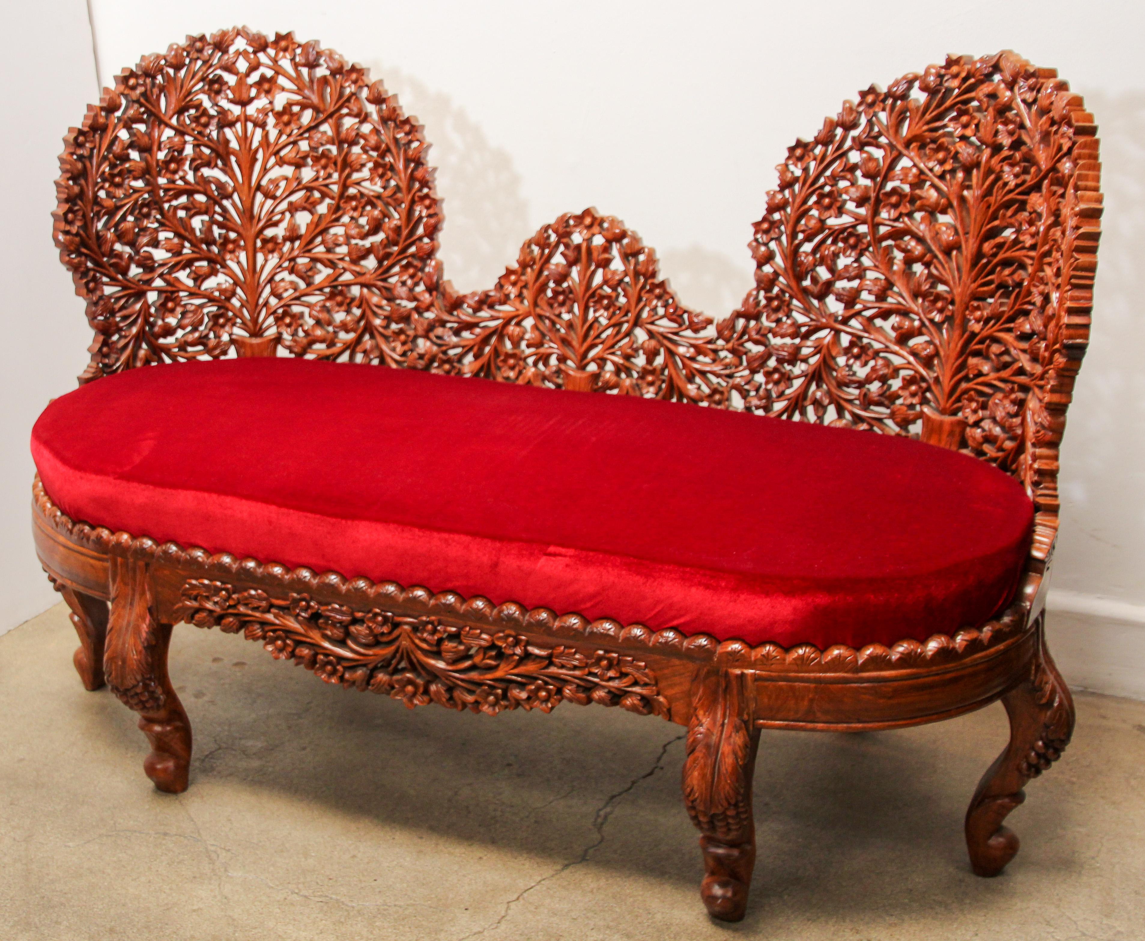 Anglo-Raj contemporary settee with foliate open carved wood back and carved legs.
Intricately detailed.
From Rajasthan, India.
Newly upholstered sofas with deep red velvet fabric.
Settee size:
Back 38