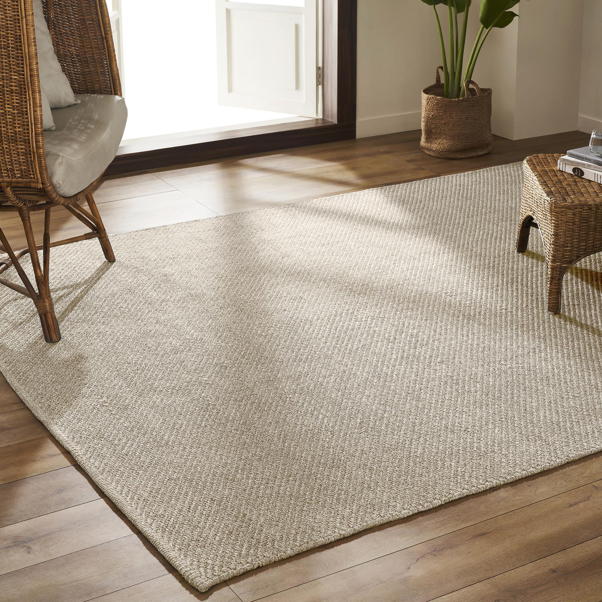 Inspired by Angola’s cultural heritage and natural beauty, this design blends rustic charm with sophistication. Featuring a braided twill weave and heathered fibers, it offers a luxurious, durable texture perfect for both indoor and outdoor