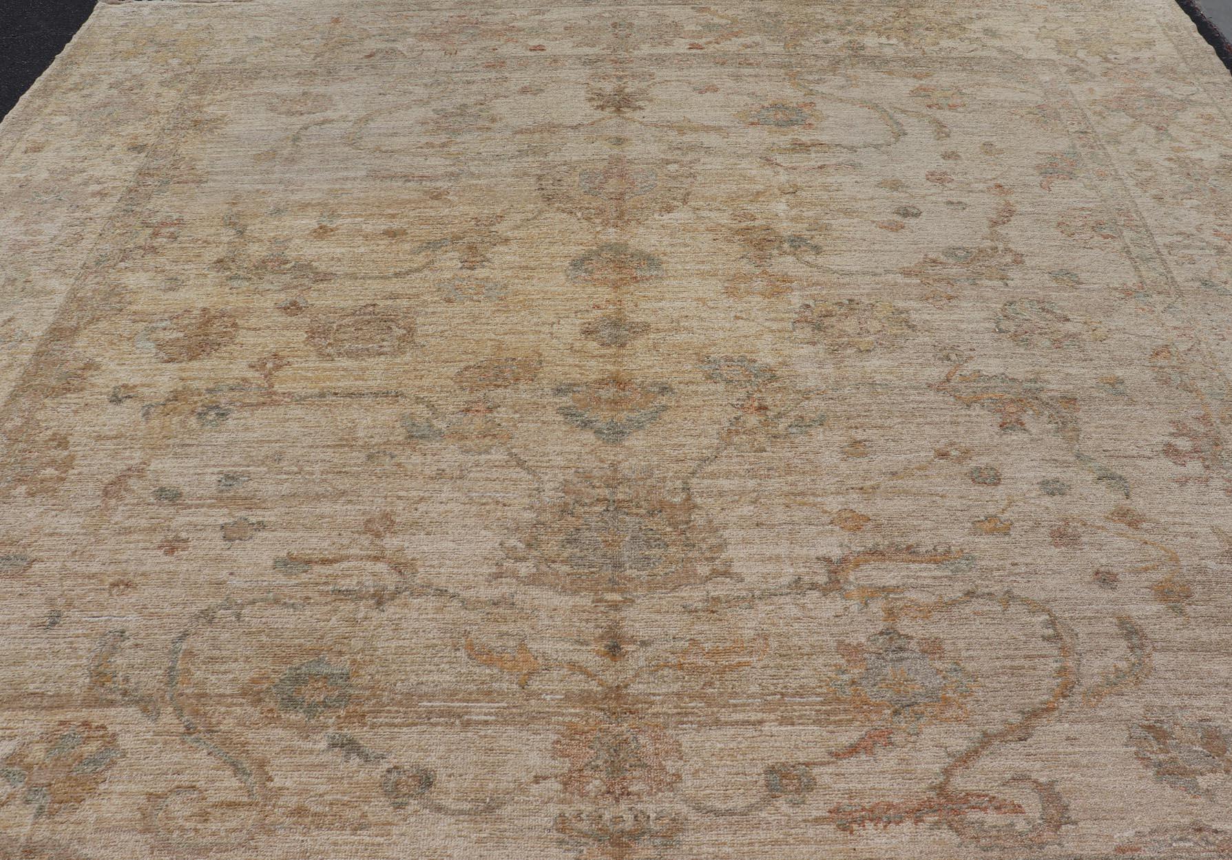 Measures: 12'9 x 13'6 
Angora Oushak Turkish Rug in Shades of Cream, Lt Green 12'9 x 13'6. Keivan Woven Arts / rug A24-0502 / country of origin / type: Turkey / Angora Oushak. 
Made with a combination of angora and old wool, this magnificent Turkish