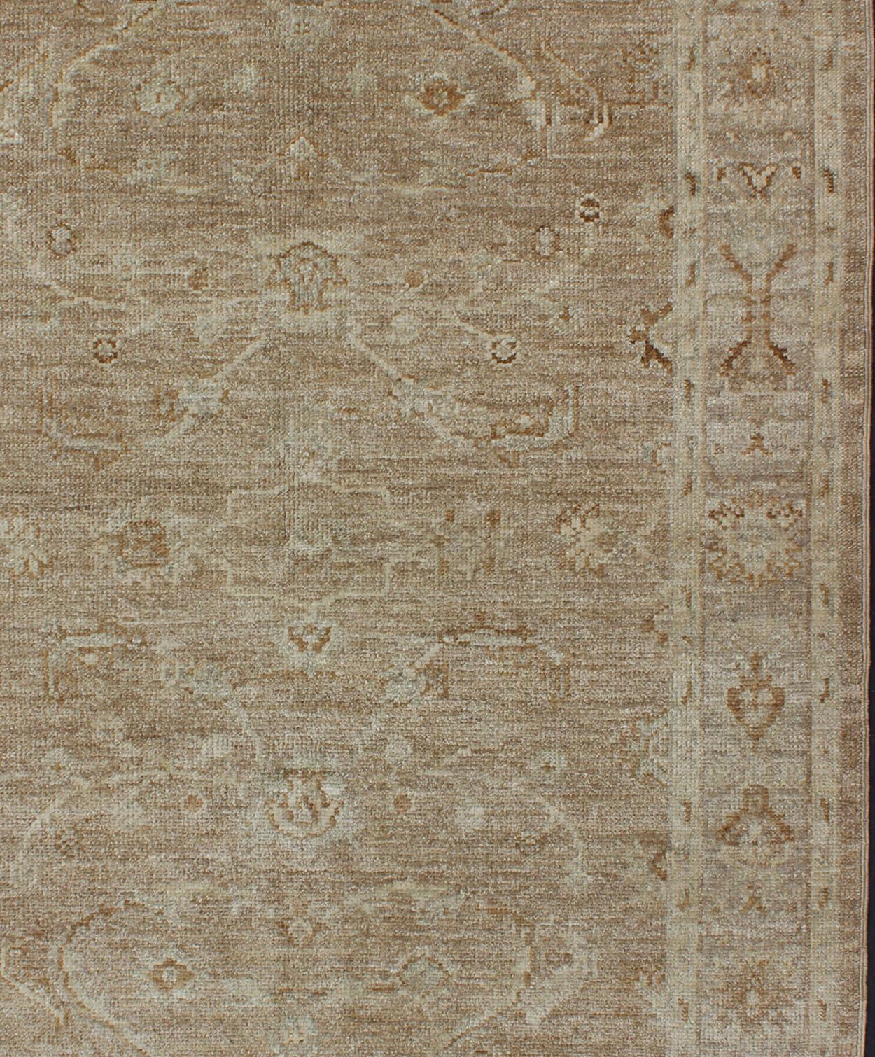 Keivan Woven Arts Angora Oushak Turkish Rug in Warm Colors of Taupe and Tan Keivan Woven Arts Angora Oushak / rug AN-125623, country of origin / type: Turkey 
Measures: 4'1 x 5'8
This beautiful taupe color Oushak is made with a combination of angora