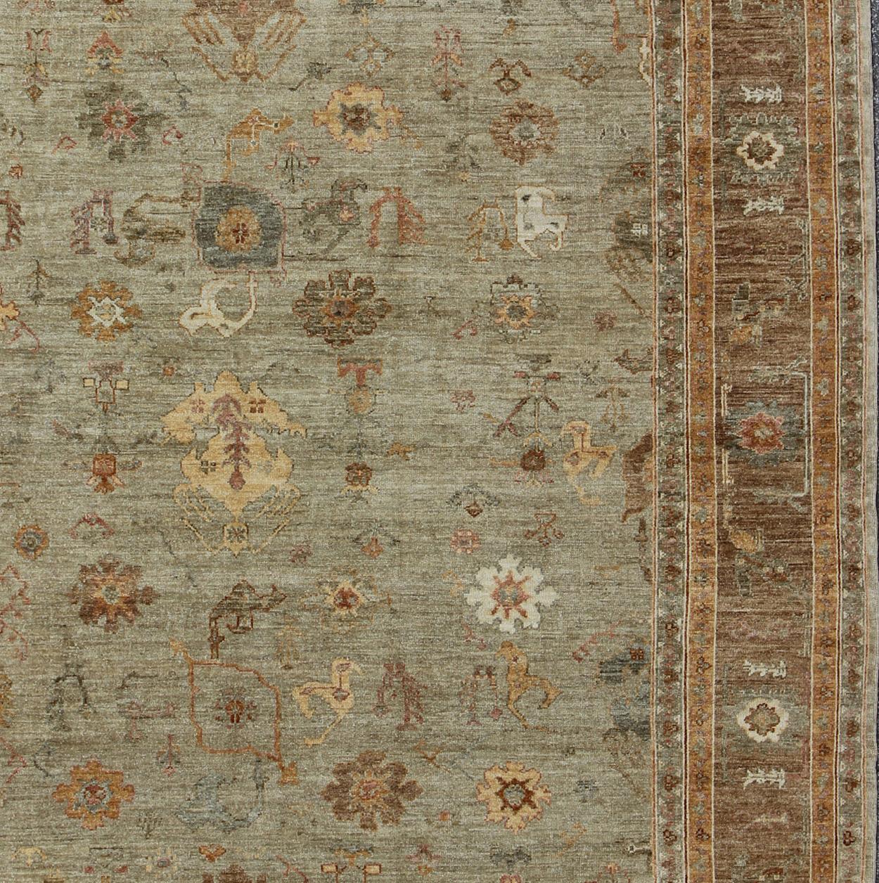 Angora Oushak Turkish rug in warm colors of taupe, green brown, cream, Angora Oushak rug from Turkey, rug AN-126705, country of origin / type: Turkey / Angora Oushak.

Measures: 11'4 x 14

This beautiful neutral color Oushak is made with a