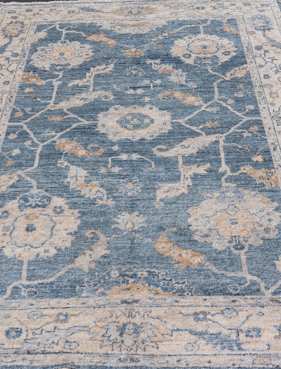 This angora Oushak has a unique floral design on top of a faded blue background with a slight cream and mocha undertone. 


Keivan Woven Arts rug AN-150778 Measures; 6'1 x 8'9 Country of Origin: Turkey Type: Oushak Design: Floral, All-Over Key