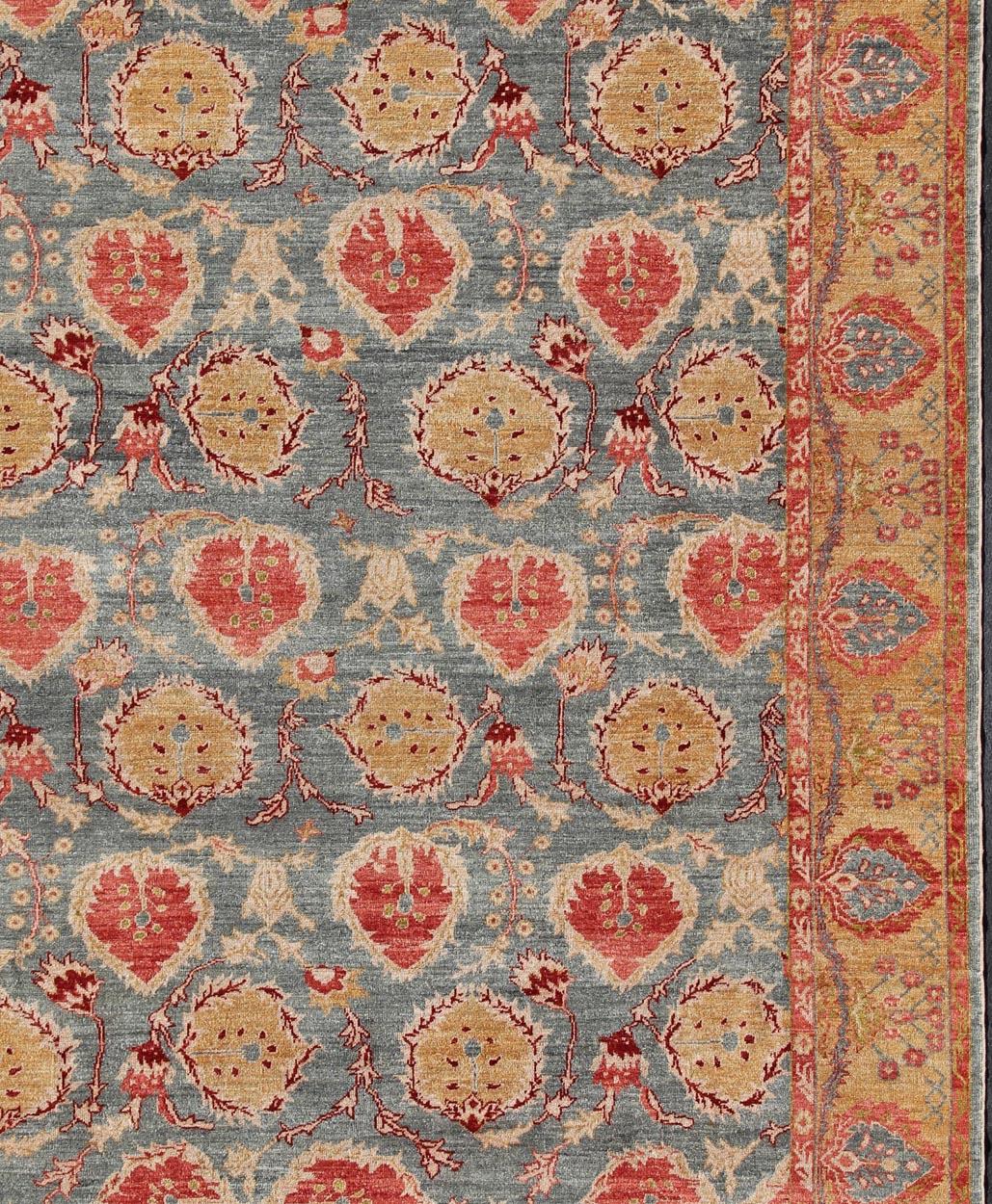 Angora Turkish Oushak Rug in Light Steel Blue Background, Gold, Orange Red, Rug #AN-115973. 
This Angora Oushak  is made with a combination of angora and old wool from antique Carpets and Kilims. Featuring all organic materials, the Angora