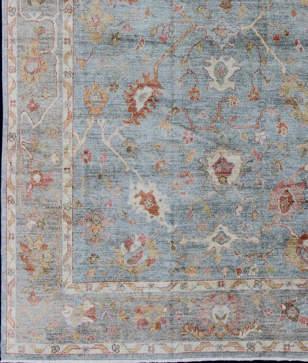 Silver, red, light blue and silver Angora Oushak rug from Turkey. Keivan Woven Arts /  rug AN-134592, country of origin / type: Turkey / Angora Oushak 
Measures: 9'3 x 12'5.
From our Angora collection, this piece is made with a combination of angora